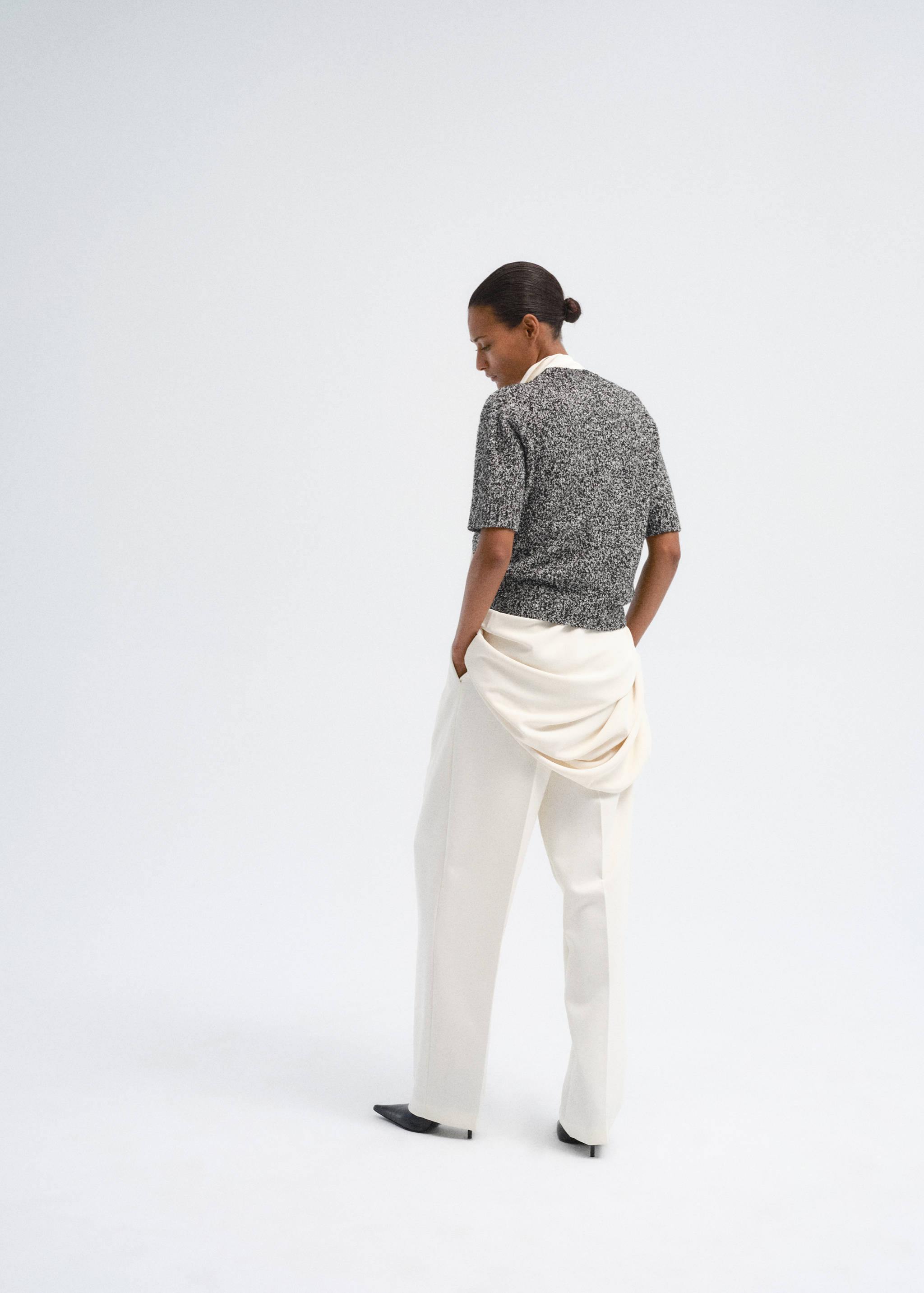 Textured grey short-sleeved jersey, back view.