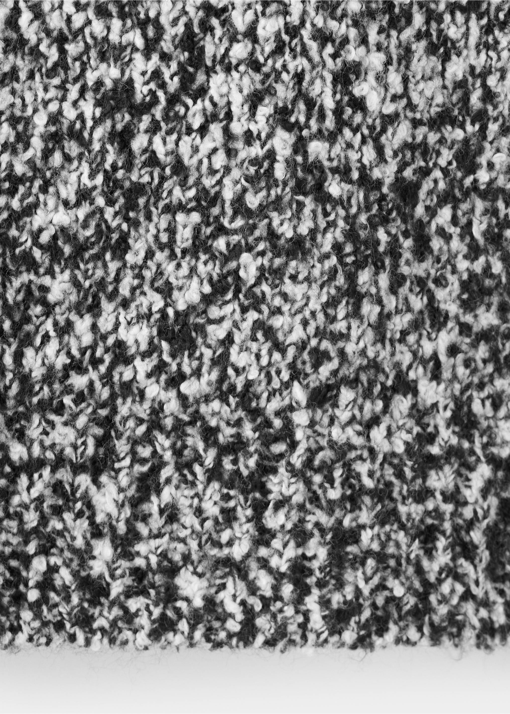 Close-up of a black and white textured knit sweater fabric., Medium Heather Grey. Ref: 37007811-00.
