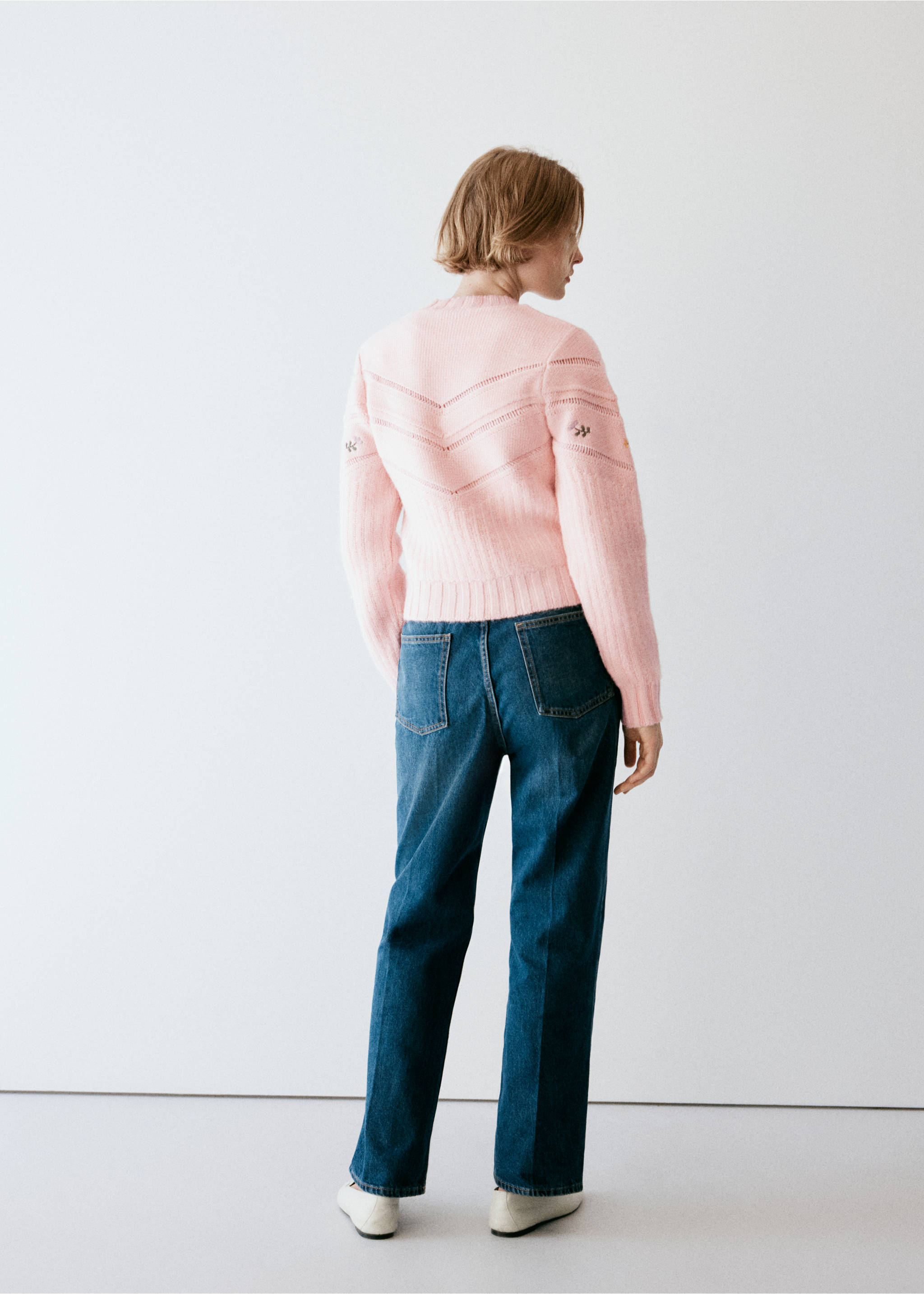 Pink knit jersey shown from the back, featuring chevron open-work detailing and ribbed trim., Pink. Ref: 37007821-00.