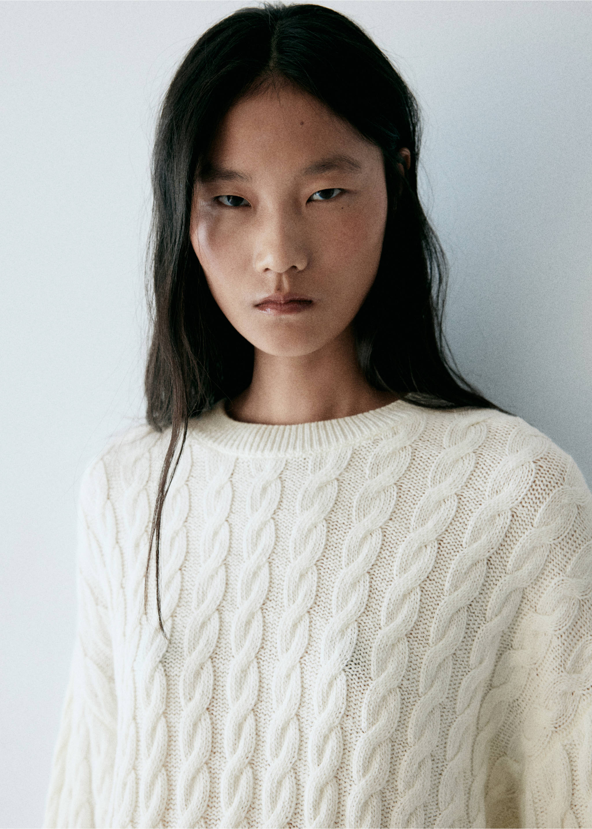 Off-white cable-knit jersey with a round neckline, shown in a close-up., Ecru. Ref: 37007825-00.