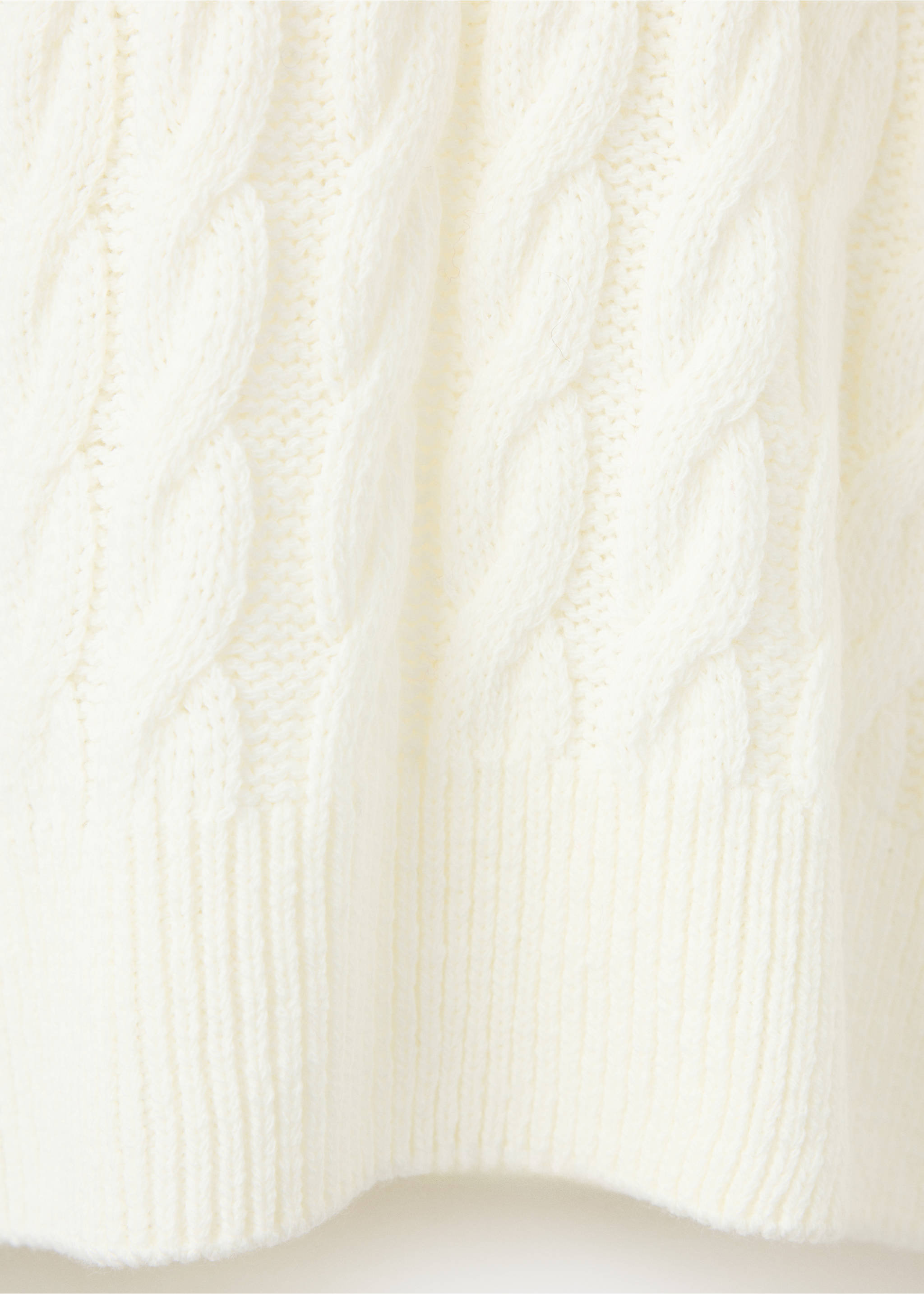 White cable-knit sweater texture detail with a ribbed hem., Ecru. Ref: 37007825-00.