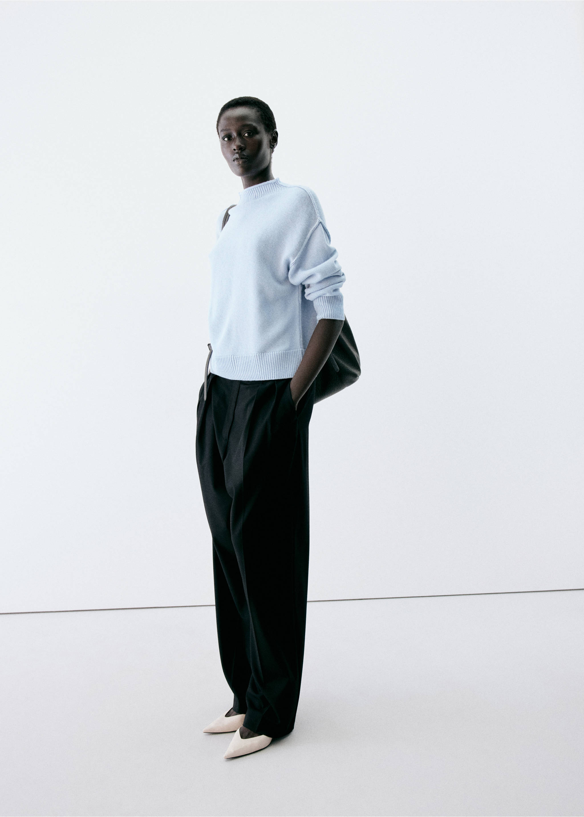 Light blue knit jersey with mock neck and ribbed hem, worn with dark trousers., Sky Blue. Ref: 37007826-00.