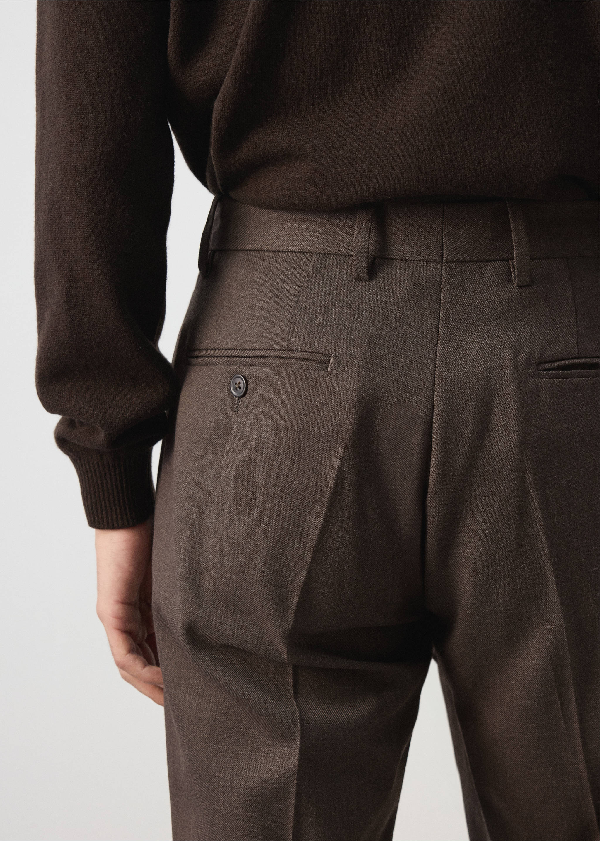 Dark brown tailored trousers with buttoned back pockets, back view., Chocolate. Ref: 37007888-00.