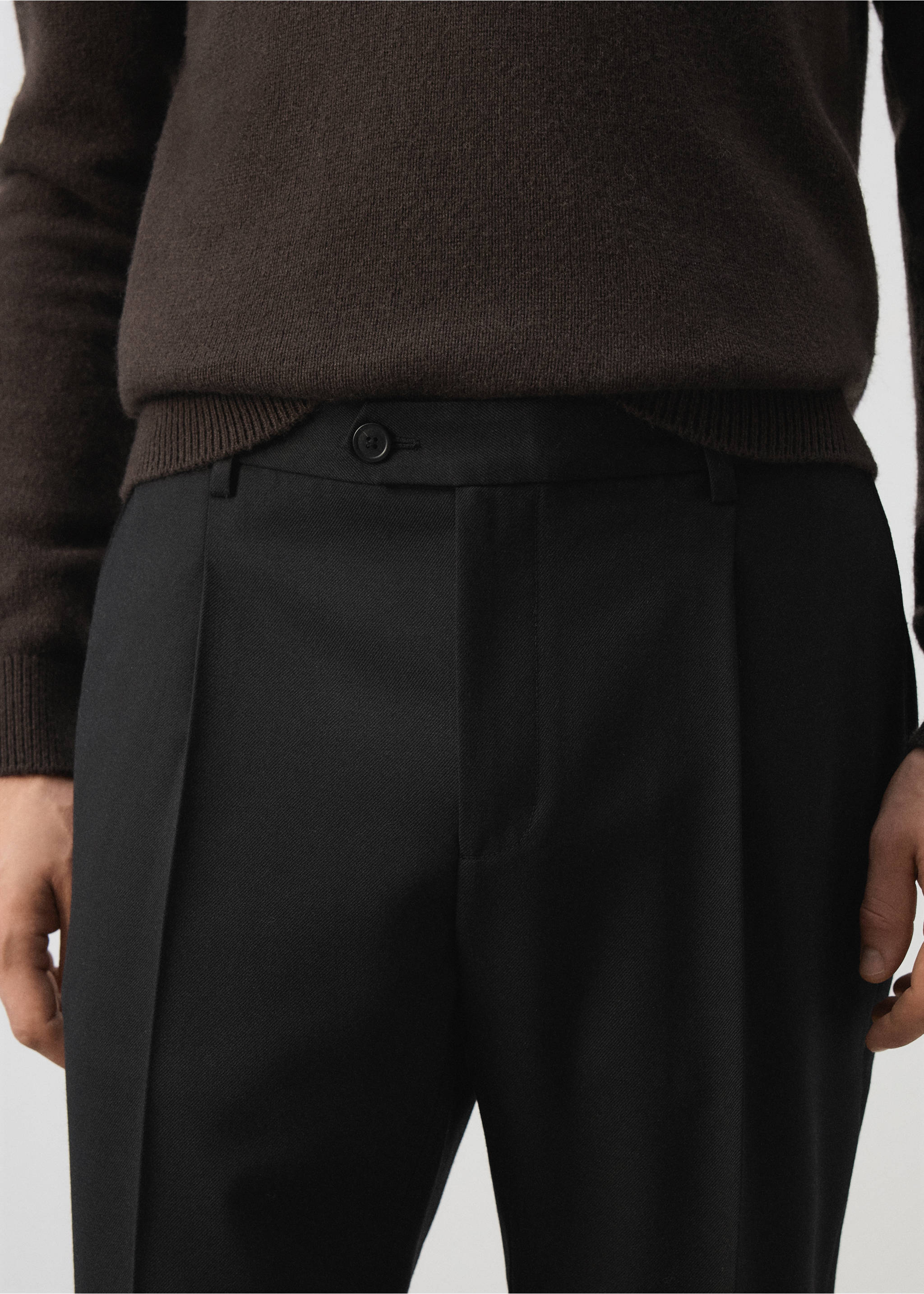 Black trousers featuring a waistband, button closure, and pressed front creases., Black. Ref: 37007888-00.