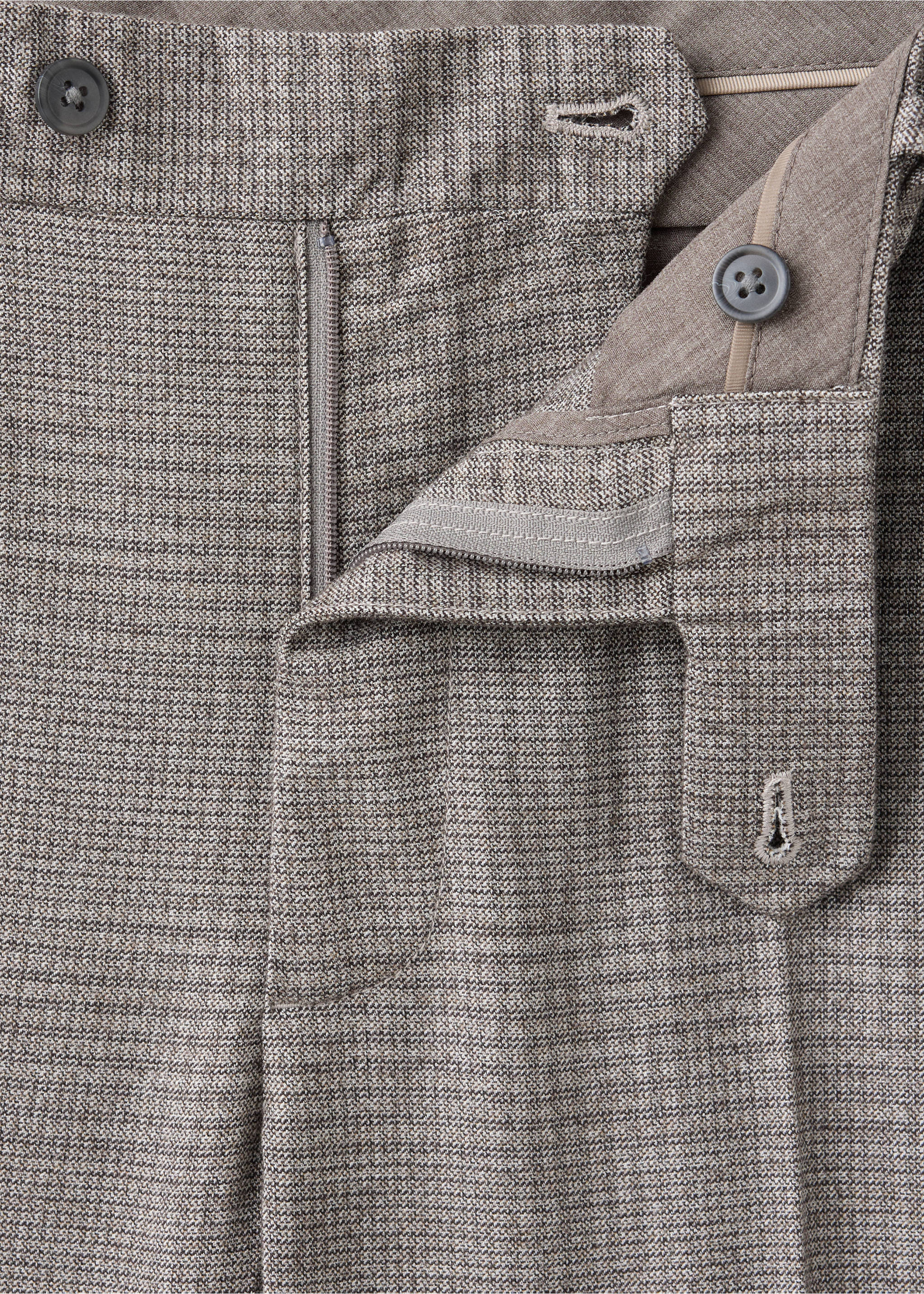 Close-up of the waistband and zip fly on brown patterned trousers., Beige. Ref: 37007890-00.