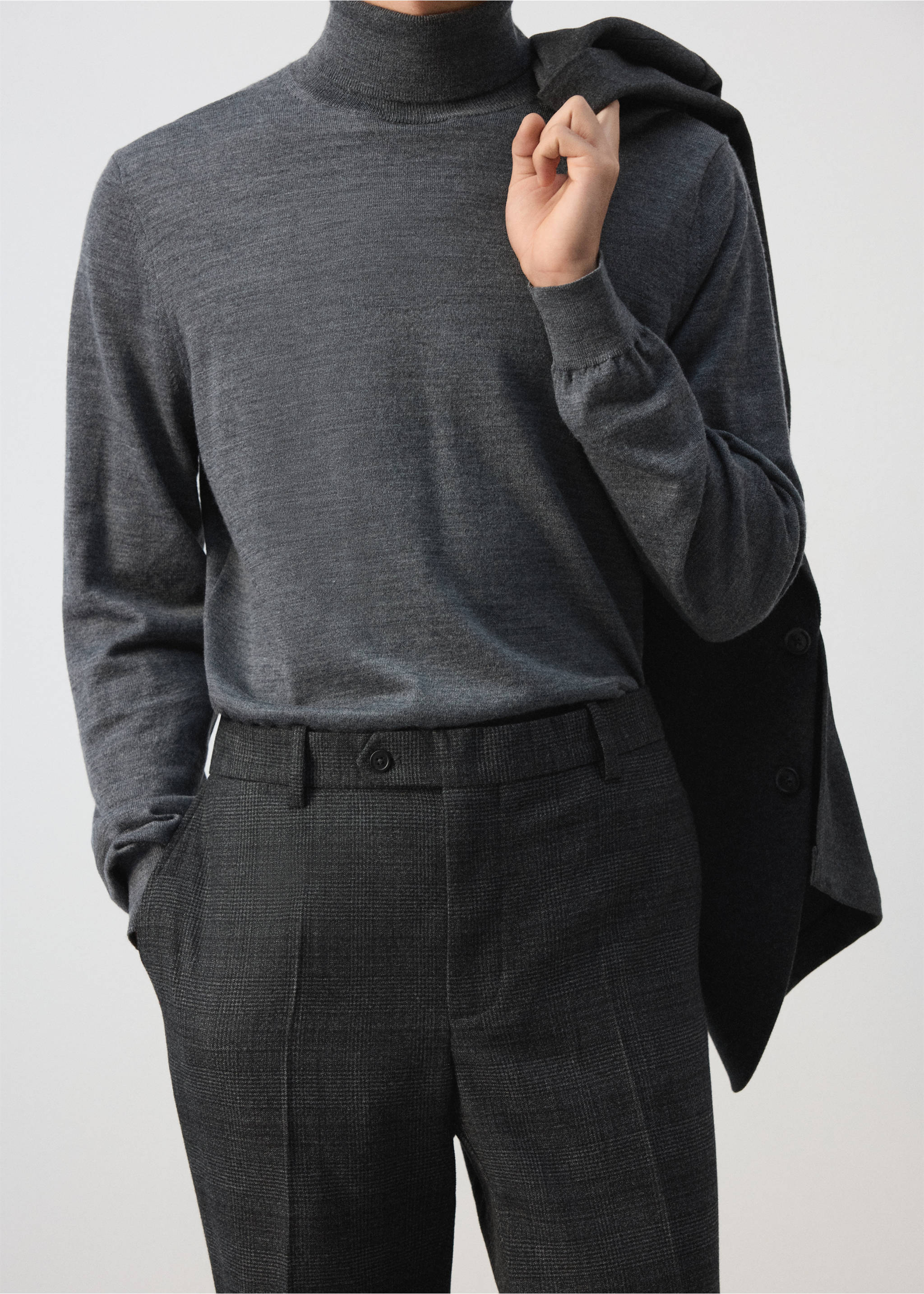 Dark grey checked trousers worn with a charcoal grey turtleneck., Dark Heather Grey. Ref: 37007891-00.