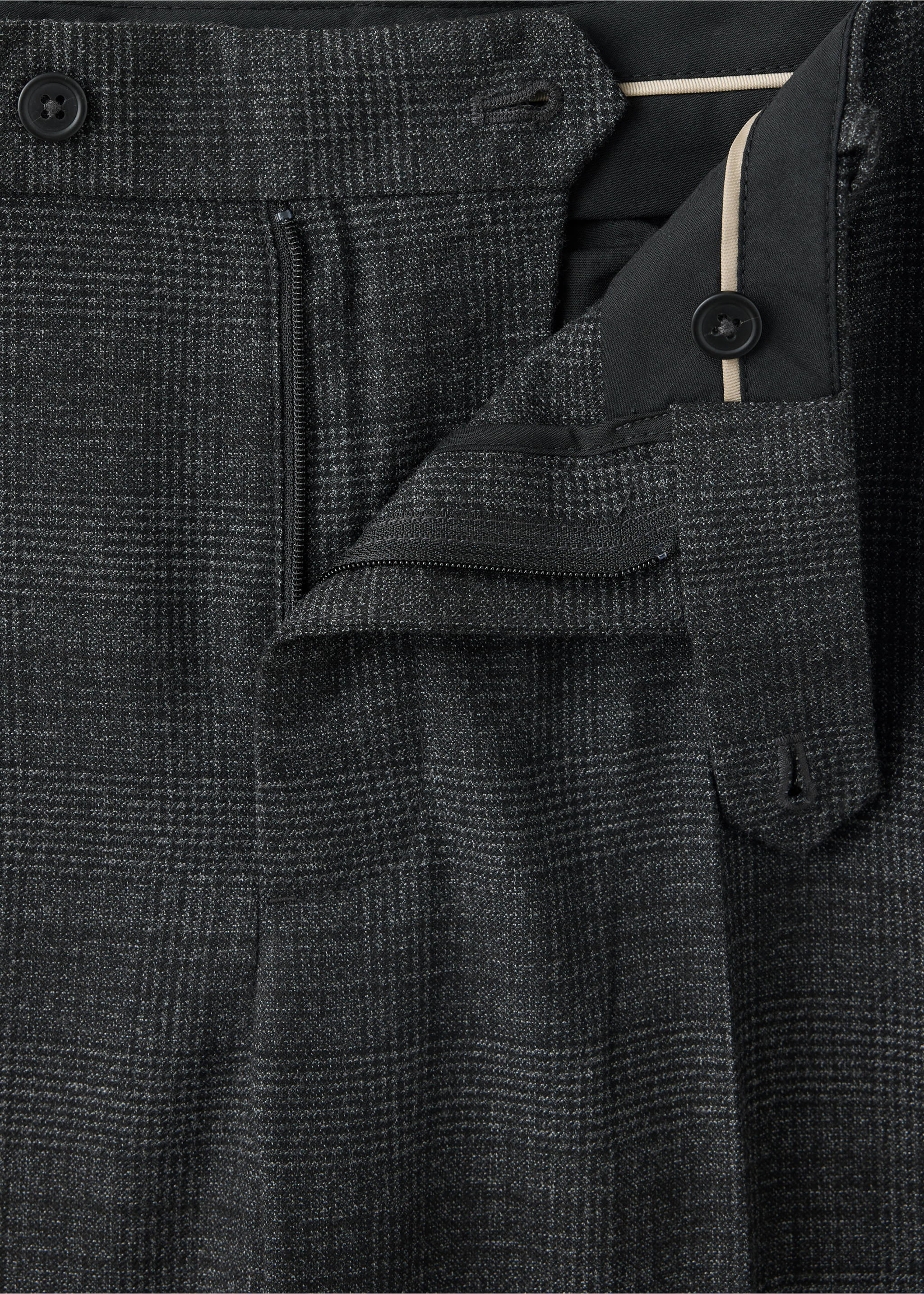 Close-up of the waistband and fastening on dark grey checked trousers., Dark Heather Grey. Ref: 37007891-00.