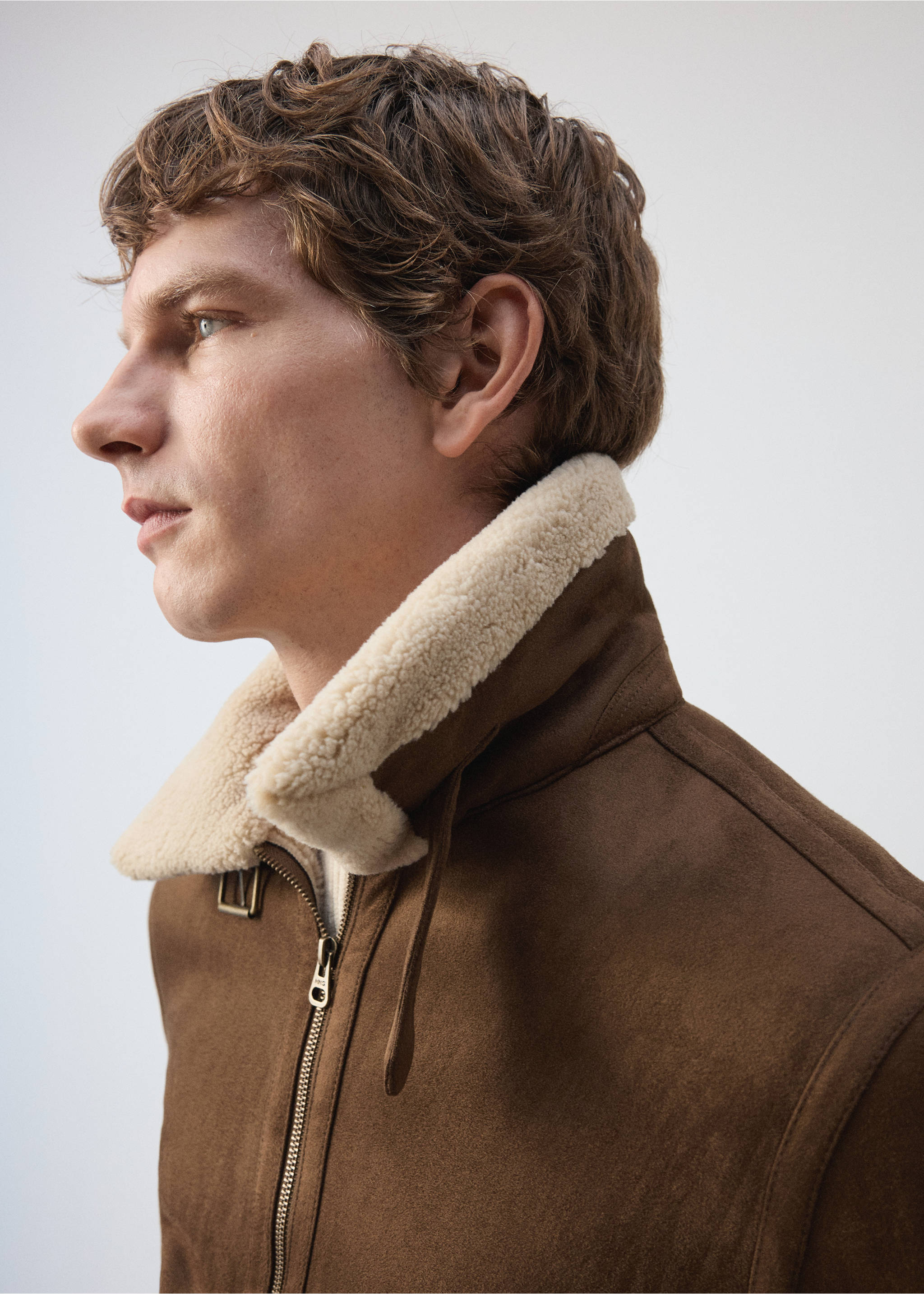Brown jacket with a cream shearling collar, shown in a close-up profile view., Tobacco Brown. Ref: 37007893-00.