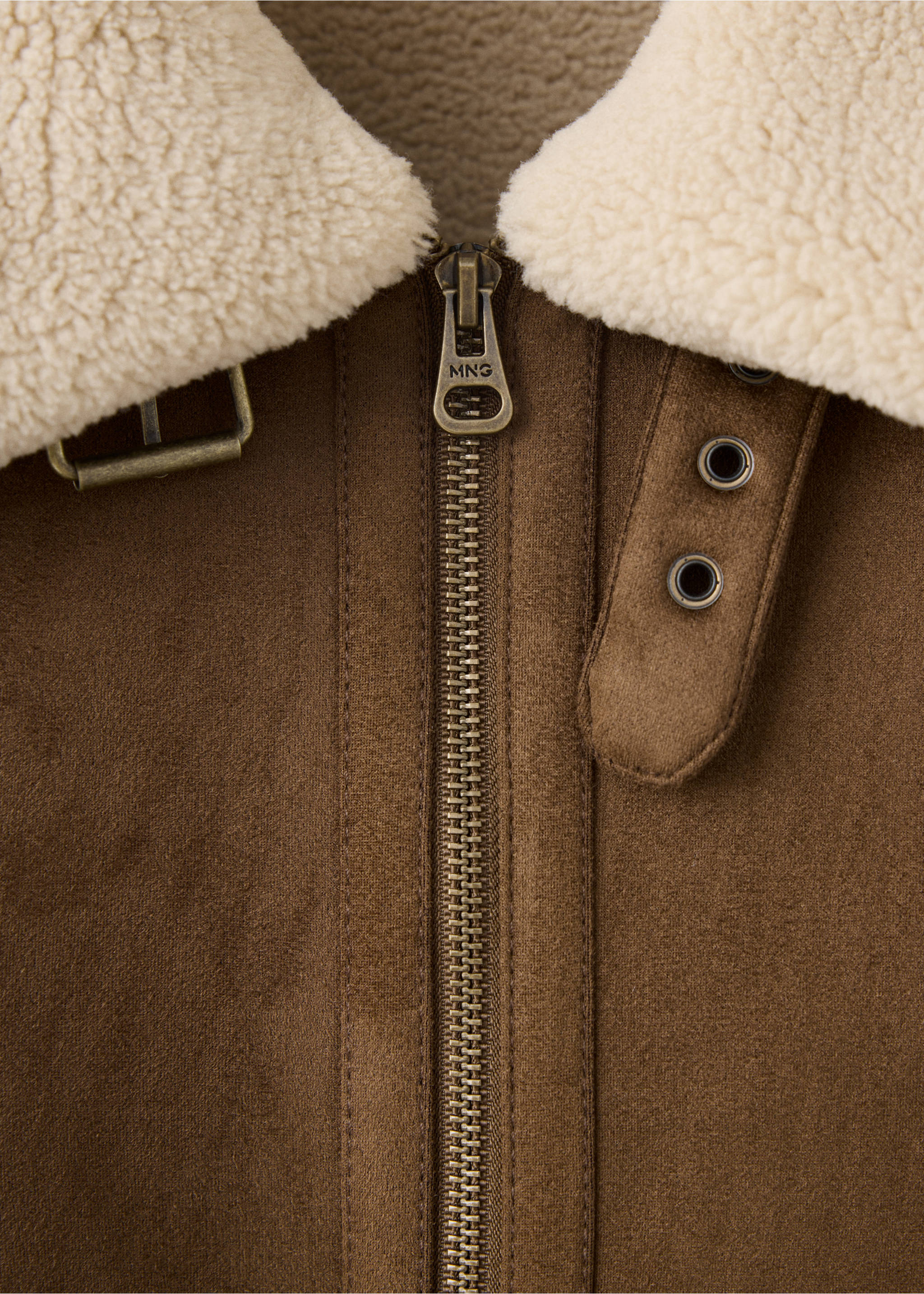 Close-up of brown jacket collar with cream shearling and brass hardware., Tobacco Brown. Ref: 37007893-00.