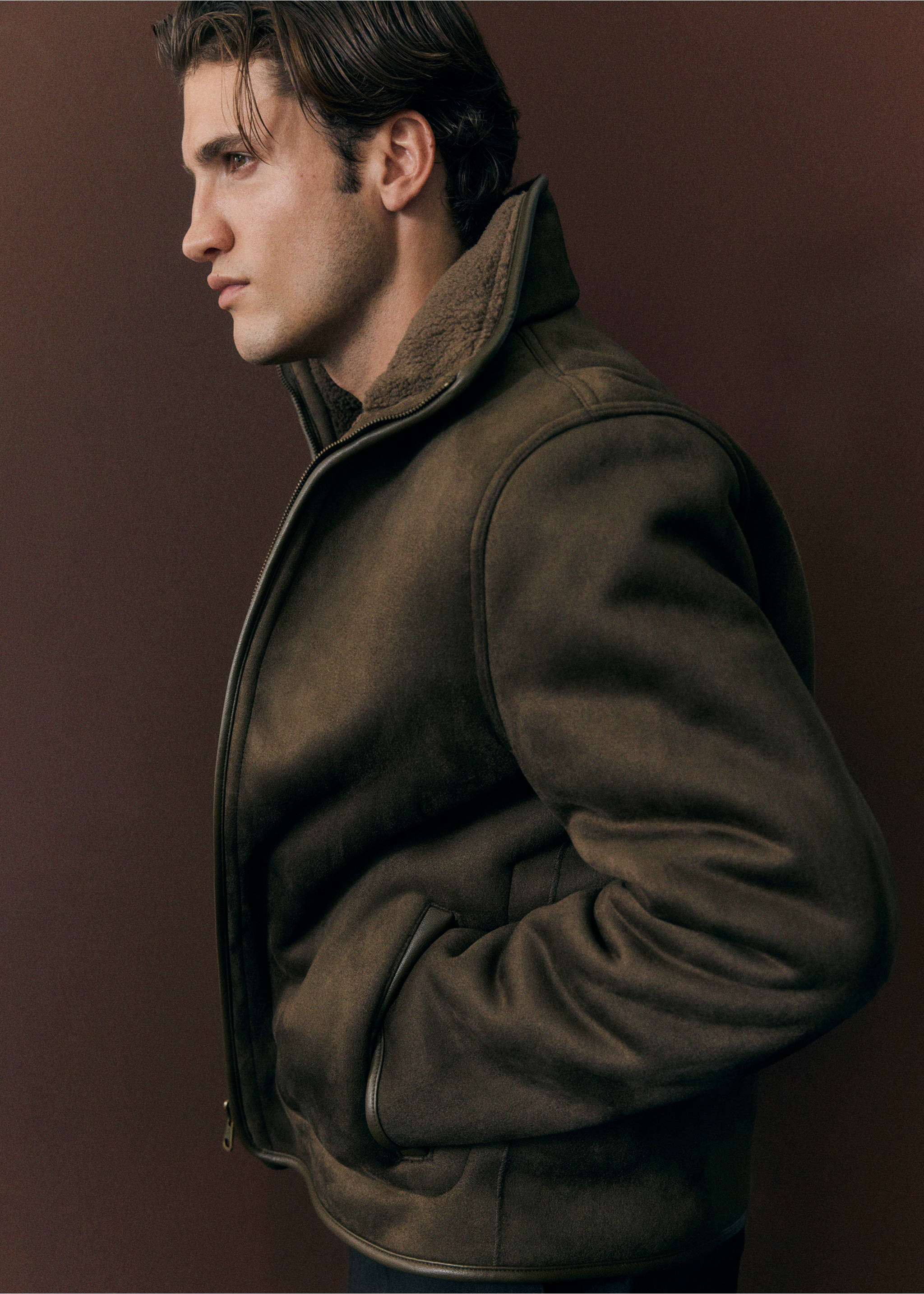 Olive green jacket with a high collar and faux-shearling lining., Olive Green. Ref: 37007894-00.