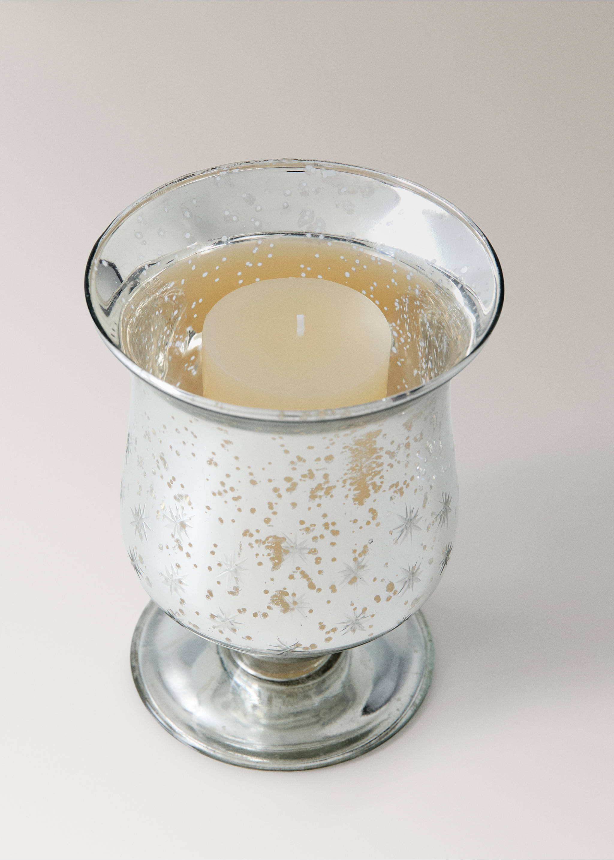 Silver mercury glass candleholder with starburst pattern and pillar candle., Silver. Ref: 37007899-00.