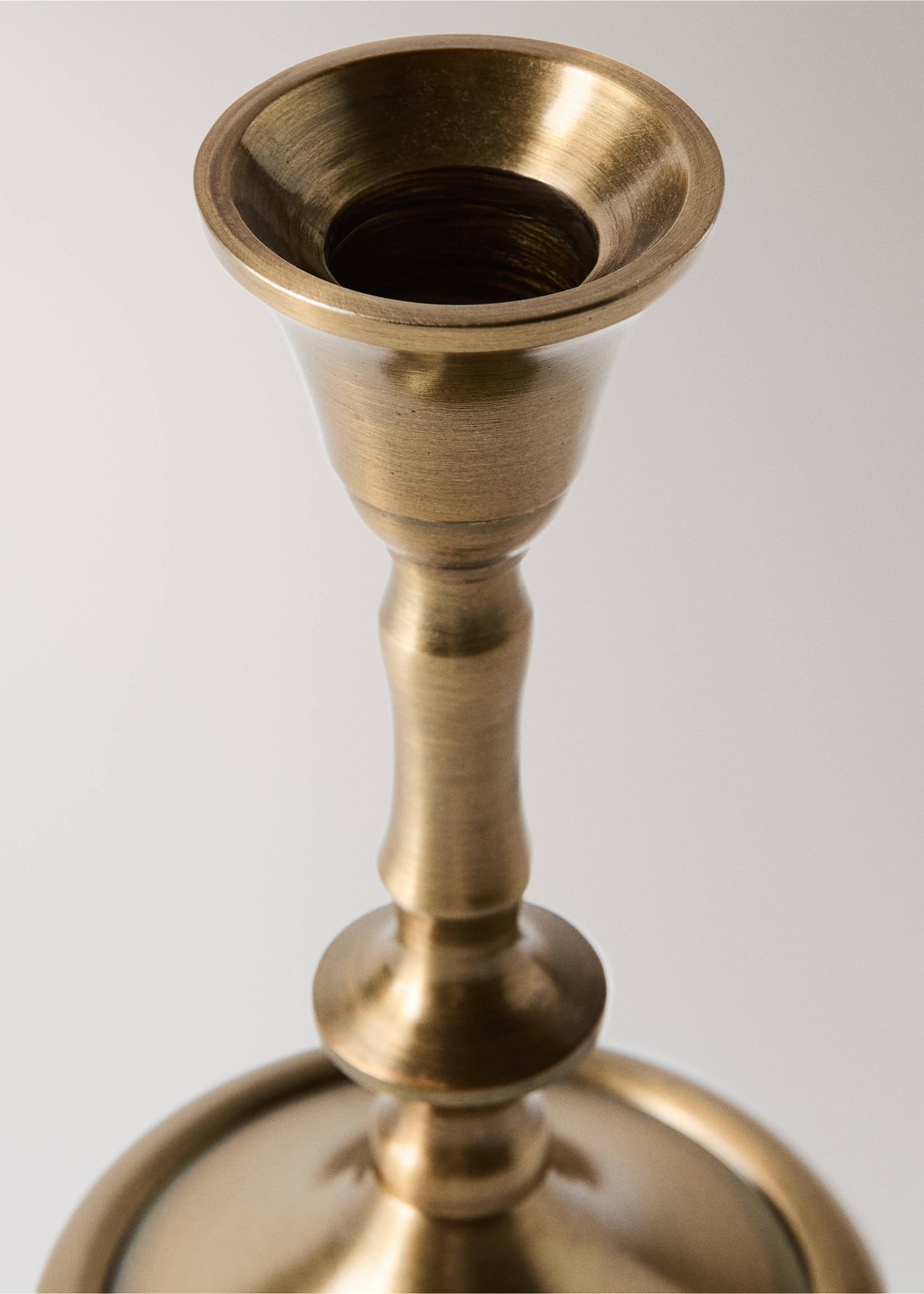 Close-up of a brass-finished metal candle holder., Gold. Ref: 37007903-00.