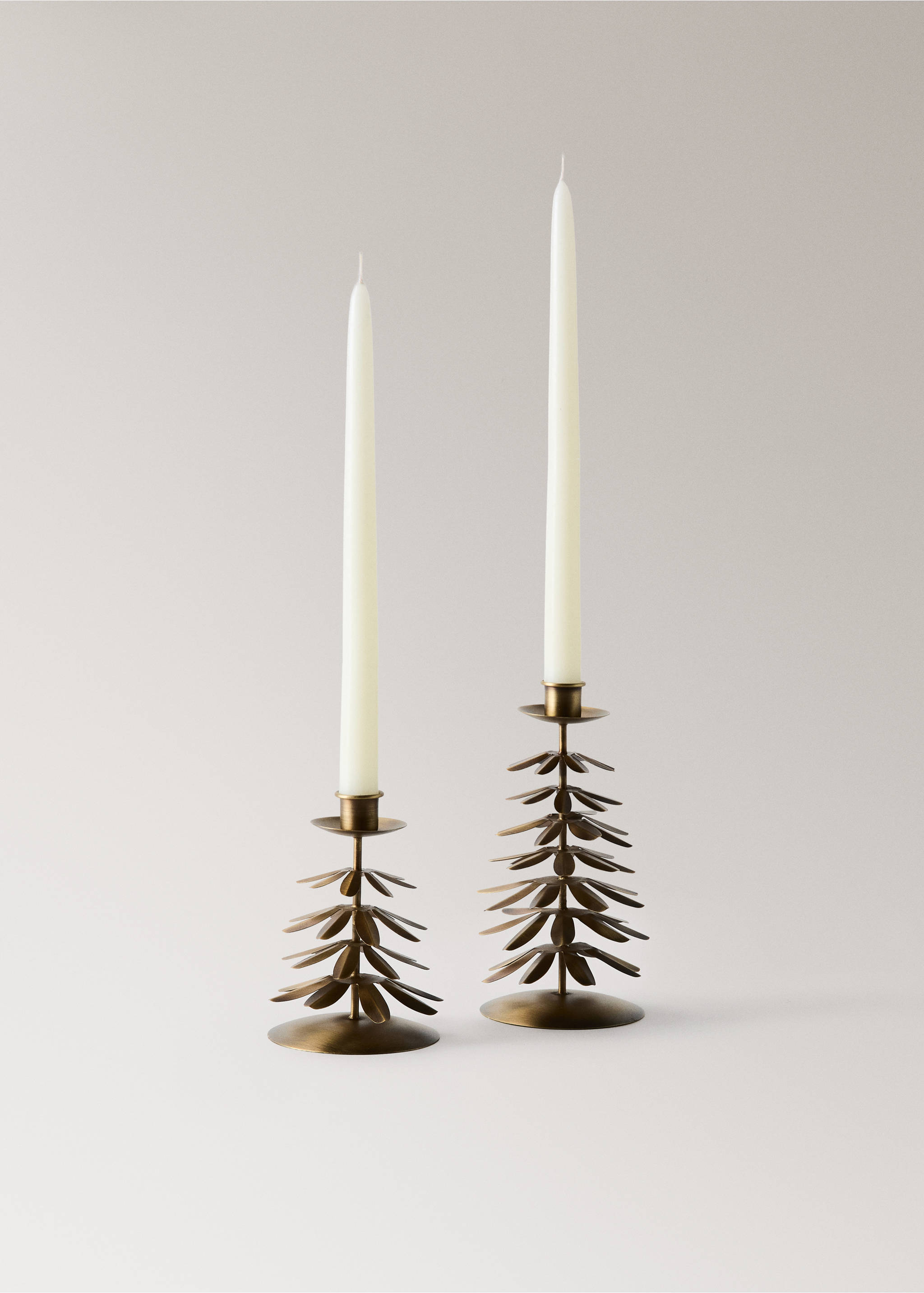 Two brass finish leaf shaped metal candle holders with white candles., Gold. Ref: 37007909-00.