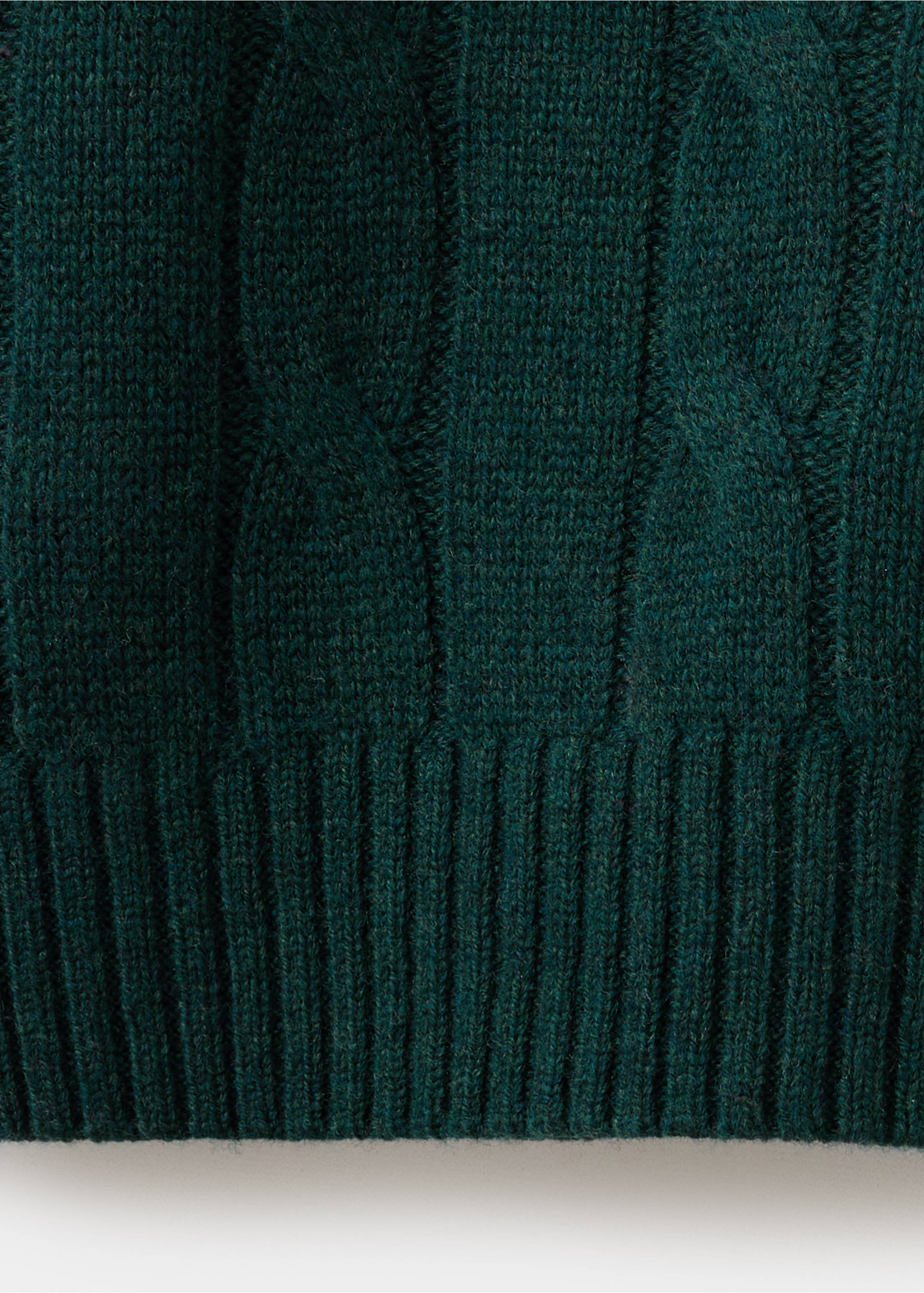 Close-up of a dark green jersey showing the cable knit texture and ribbed hem., Dark Green. Ref: 37007921-00.