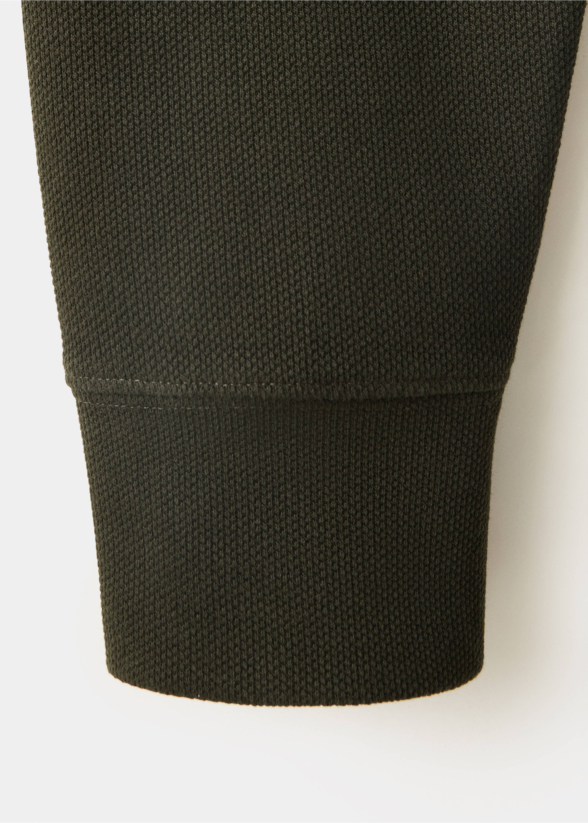 Close-up of the dark green sweatshirt sleeve showing the textured knit and ribbed cuff., Dark Green. Ref: 37007922-00.