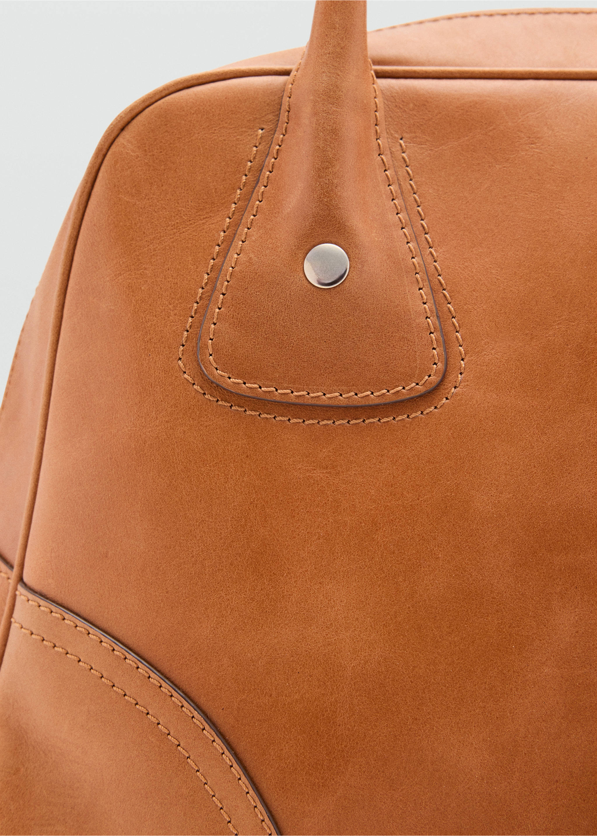 Tan bowling bag detail showing handle attachment and topstitching., Leather. Ref: 37007944-00.