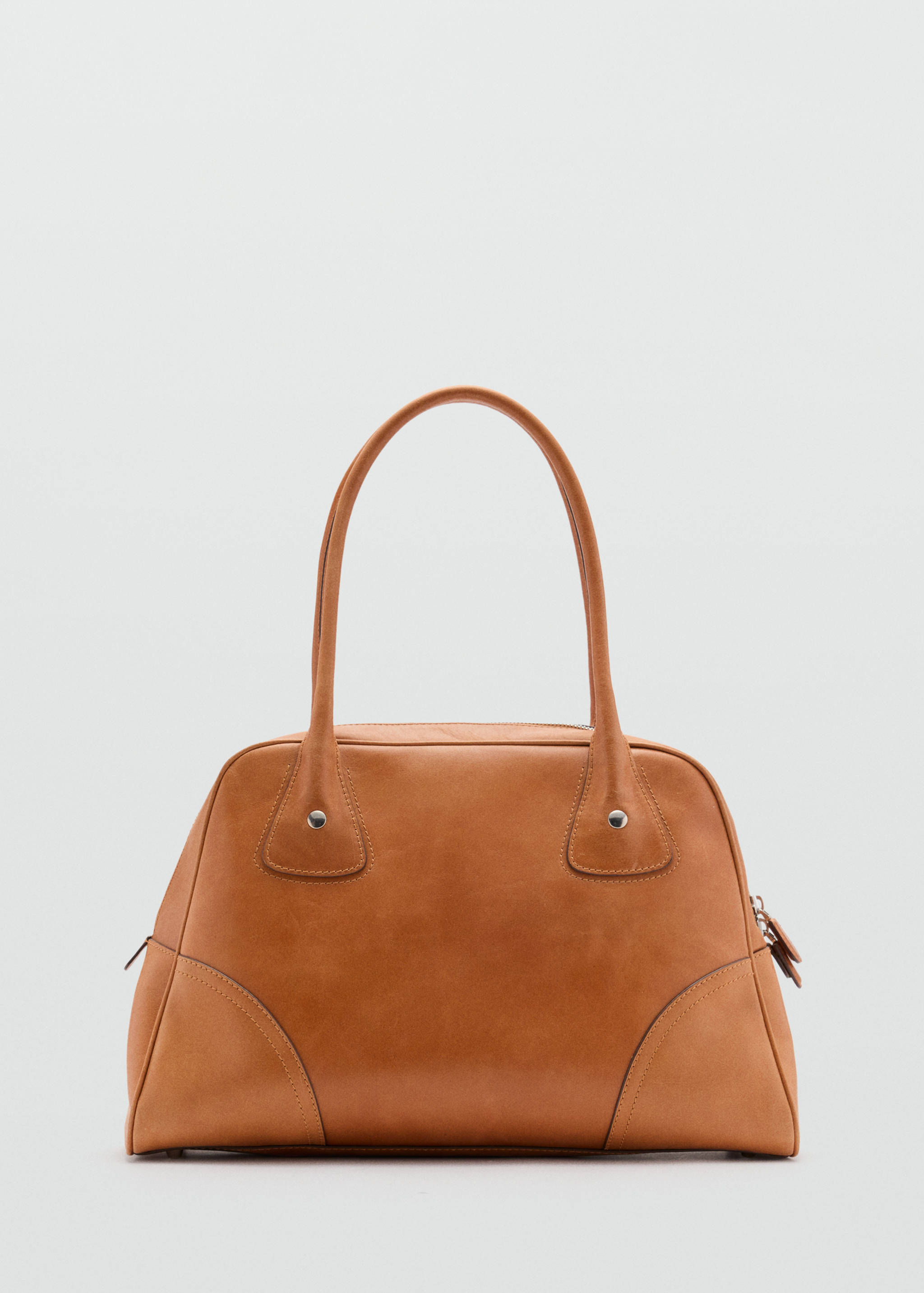 Brown bowling bag with a structured trapezoidal silhouette and dual top handles.