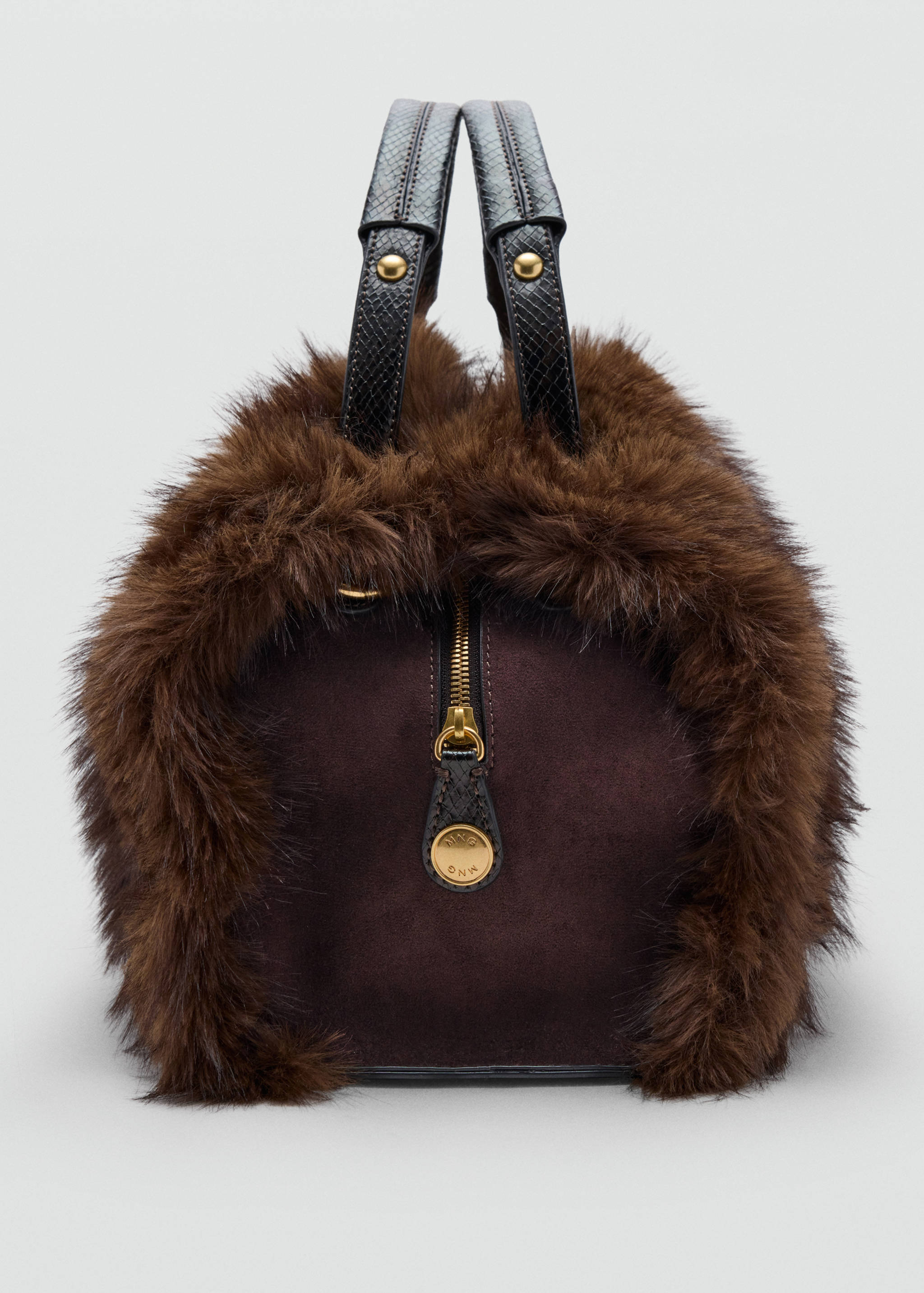 Brown faux-fur shoulder bag featuring suede panels and dark structured handles.