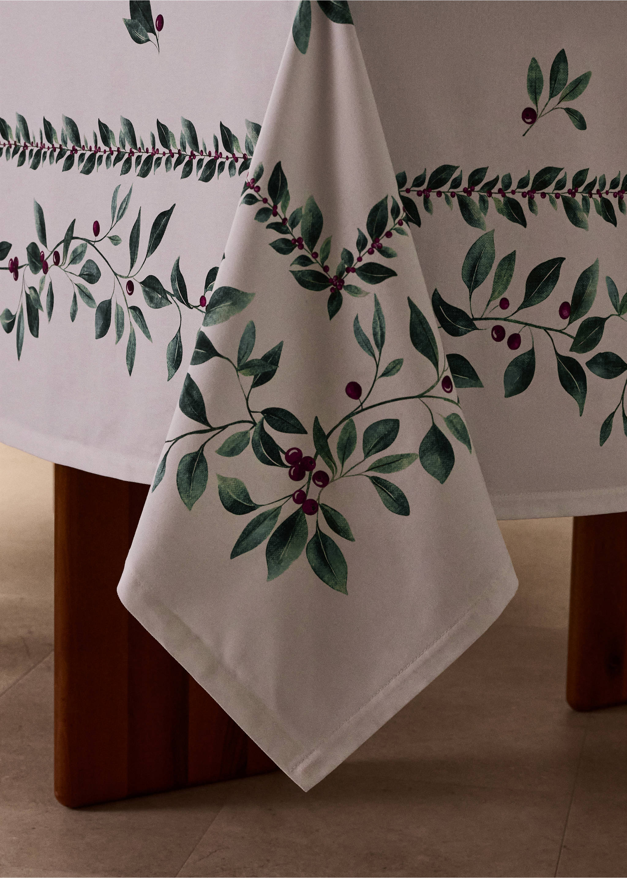 Off-white tablecloth with green leaf and red berry print., White. Ref: 37008277-00.