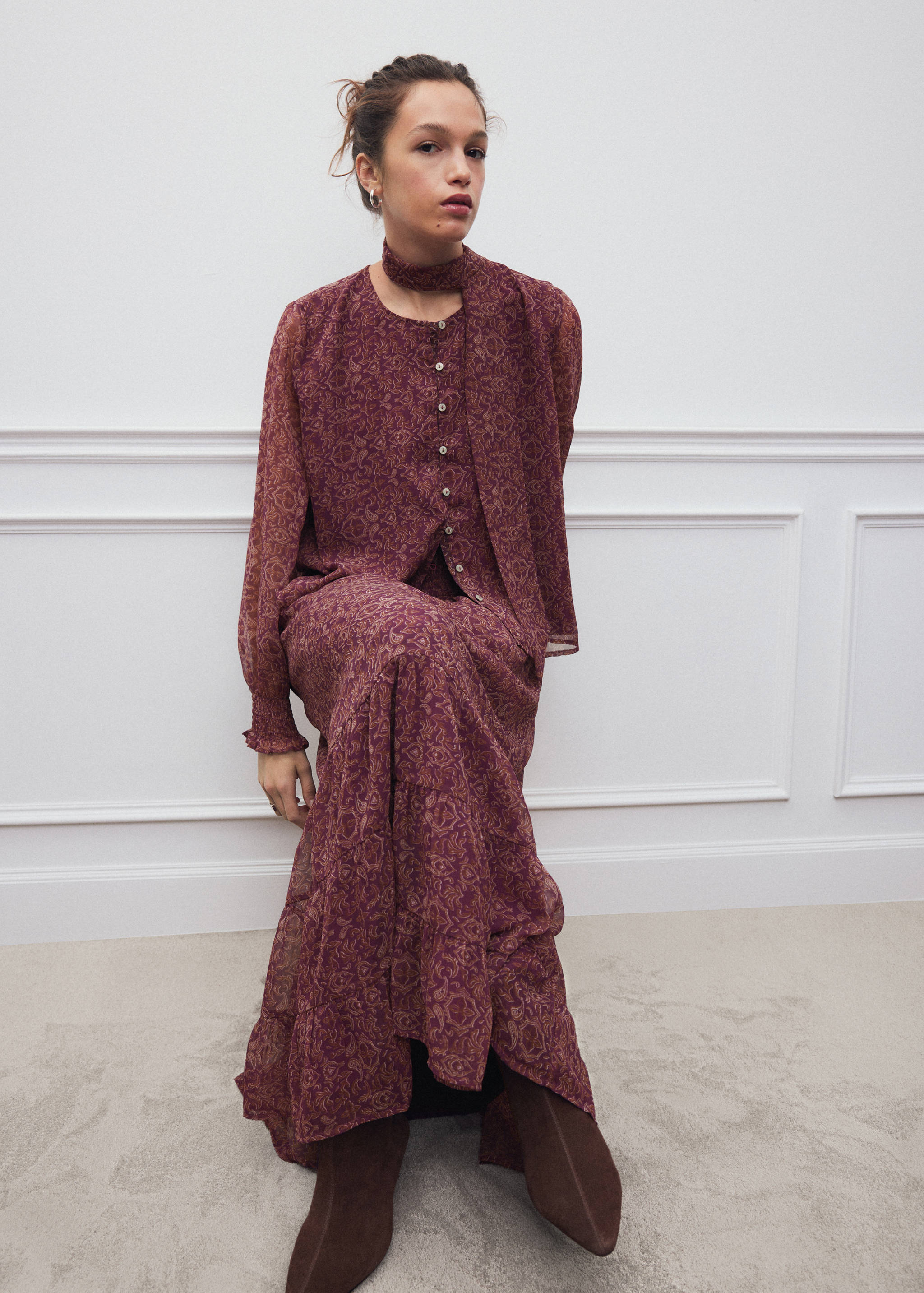 Dark red patterned long-sleeve shirt with a matching scarf and buttons.