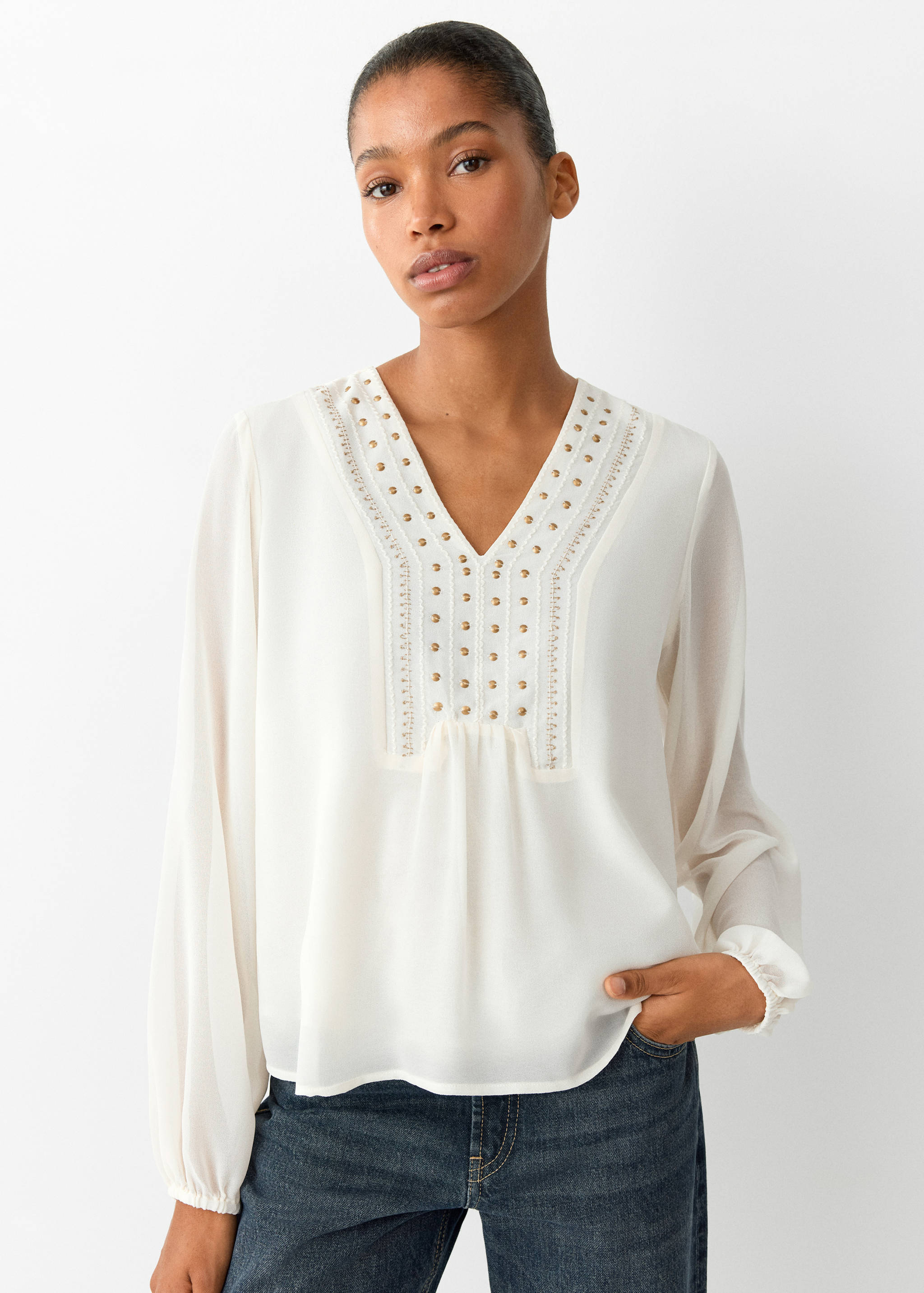 Off-white long-sleeved shirt with V-neck and stud details