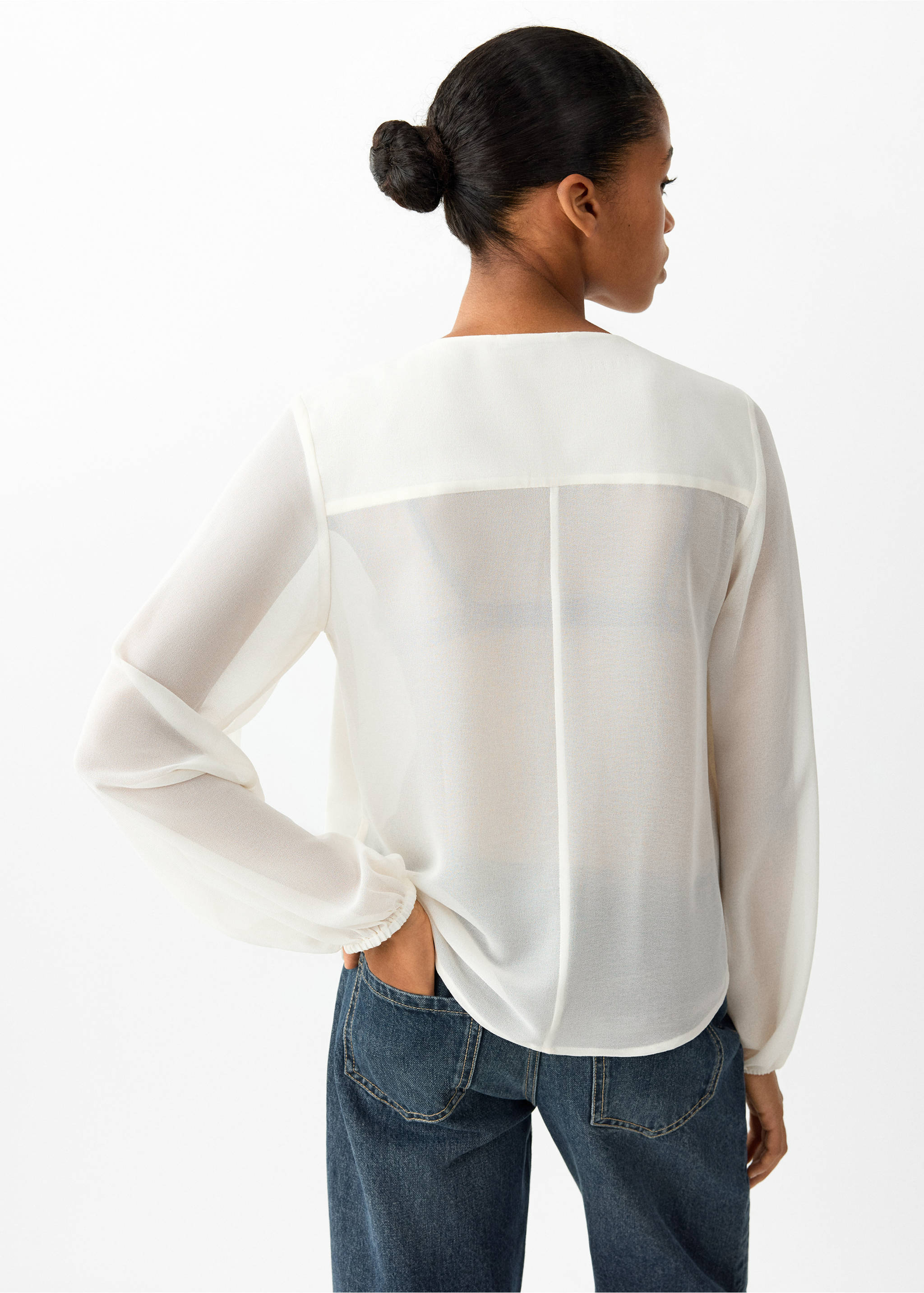 Back view of a white long-sleeved shirt in a sheer fabric, worn with blue jeans., Off White. Ref: 37008282-00.