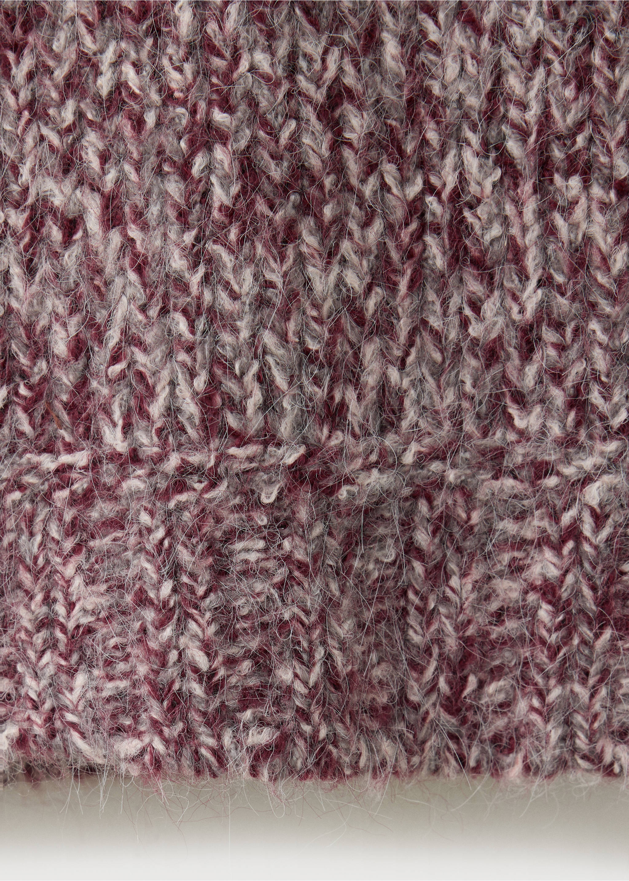 Close-up of the fuzzy knit fabric and texture of a jersey in burgundy and grey., Pink. Ref: 37008283-00.