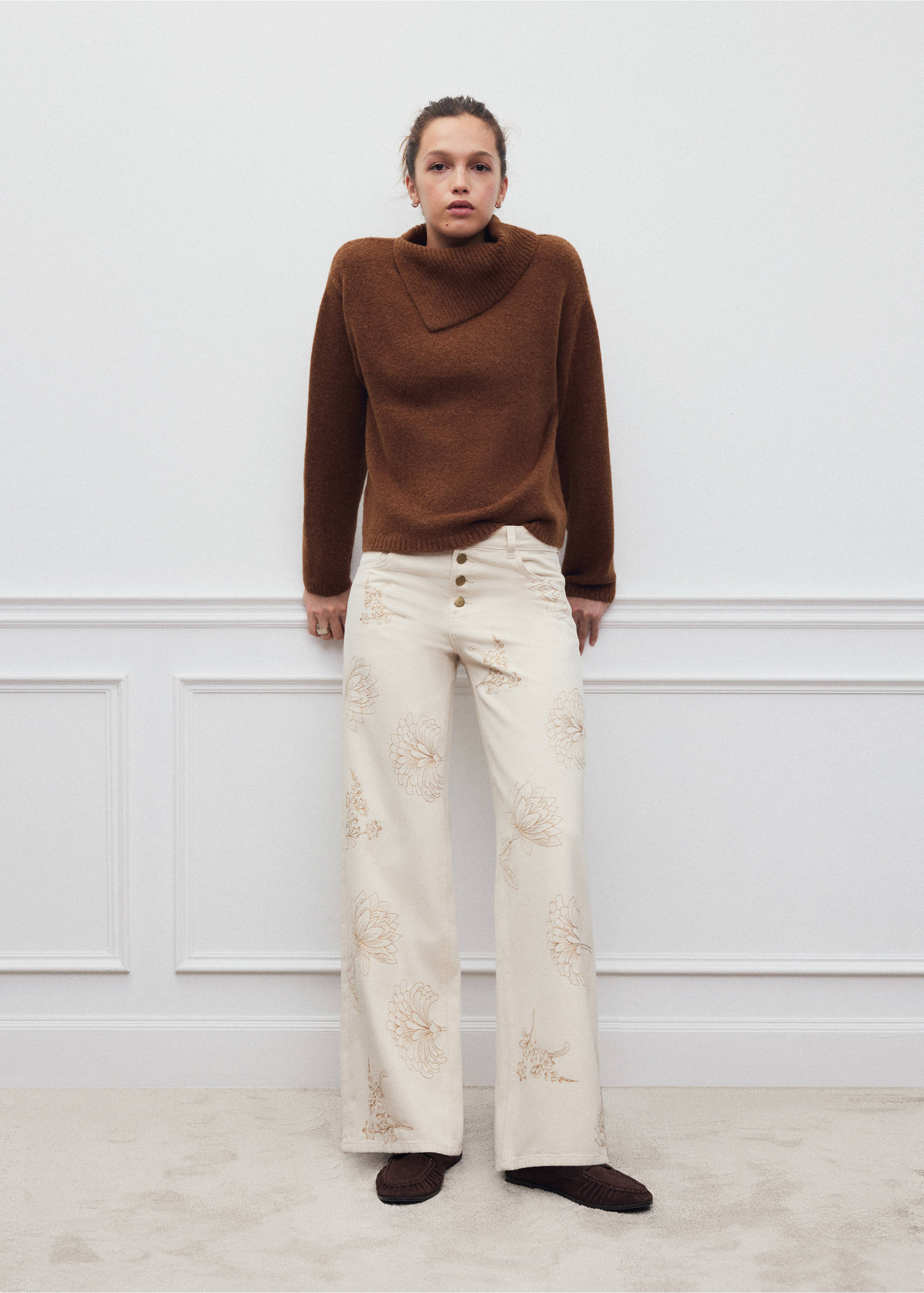 Brown jersey with an asymmetrical cowl neck, worn with embroidered cream trousers., Caramel. Ref: 37008289-00.