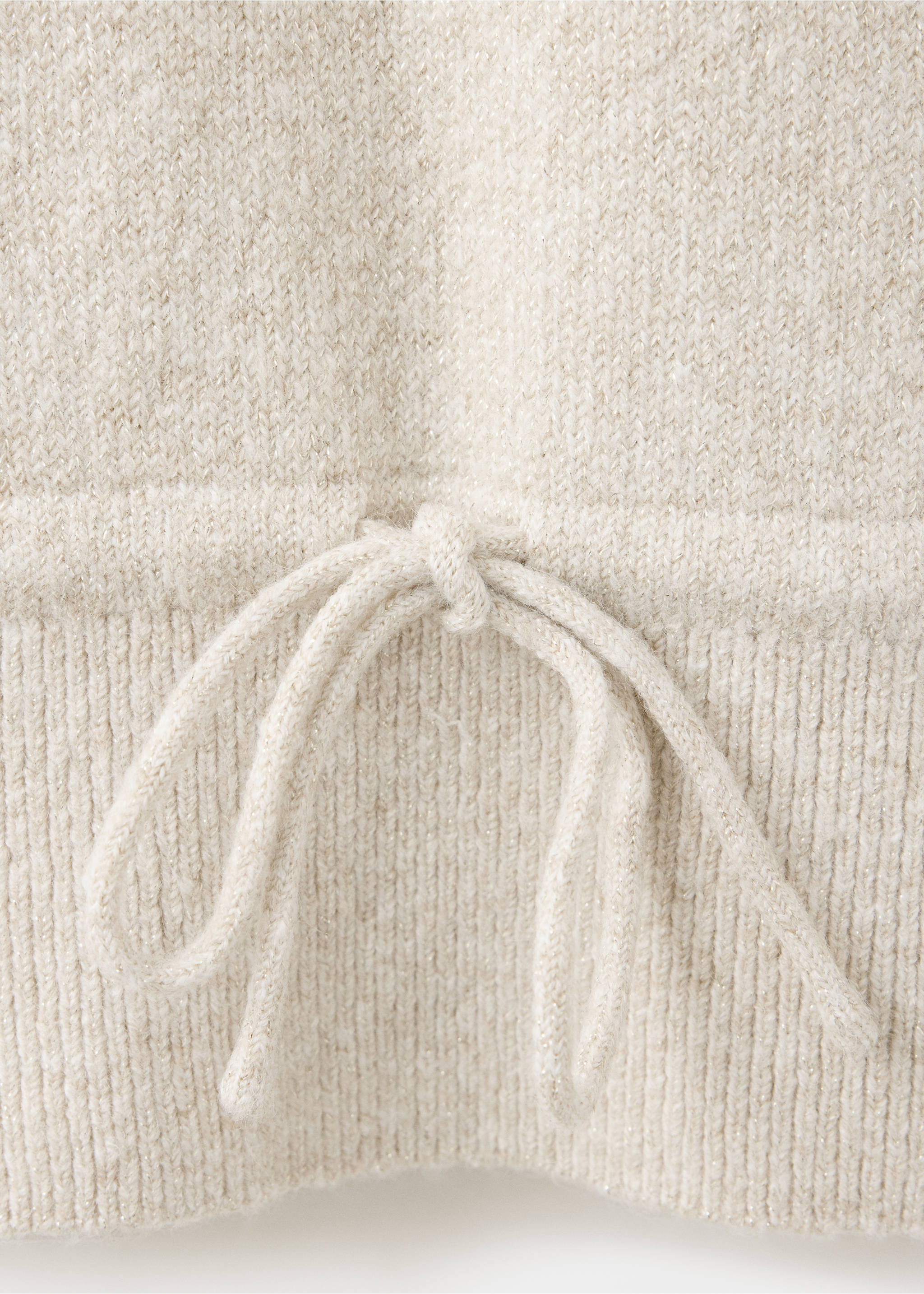Close-up of a light beige knit jersey showing the fabric detail and drawstring waist., Beige. Ref: 37008290-00.