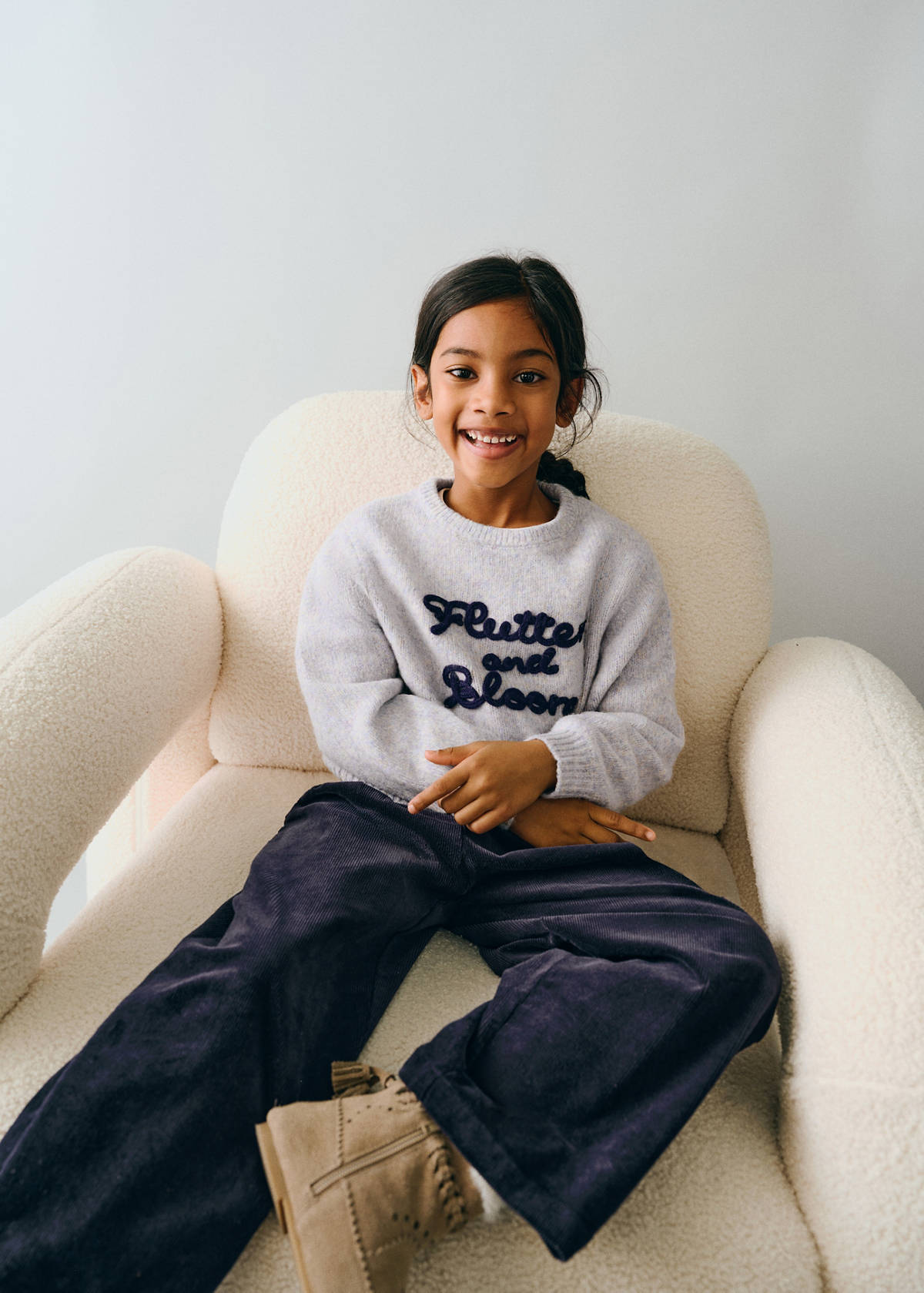 Embossed embroidered knit sweater