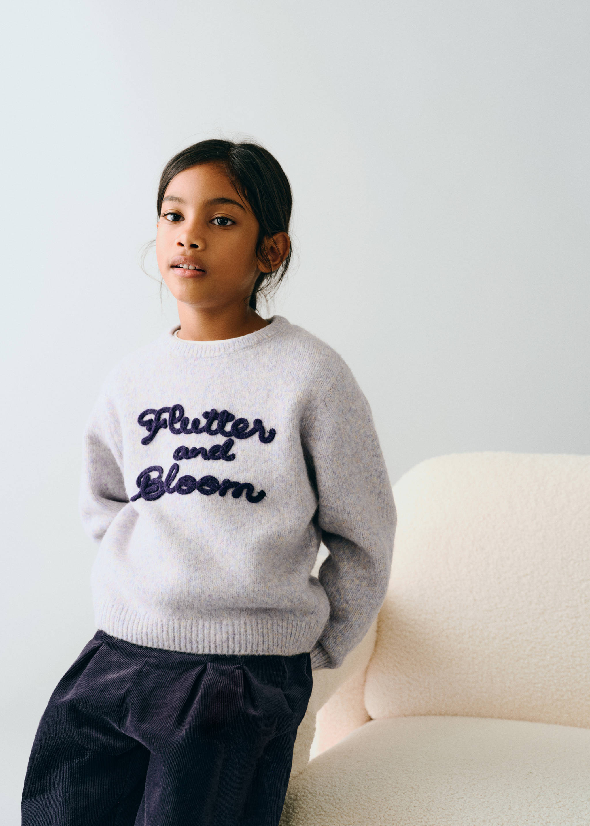 Light purple marled knit jumper with navy embroidered text.