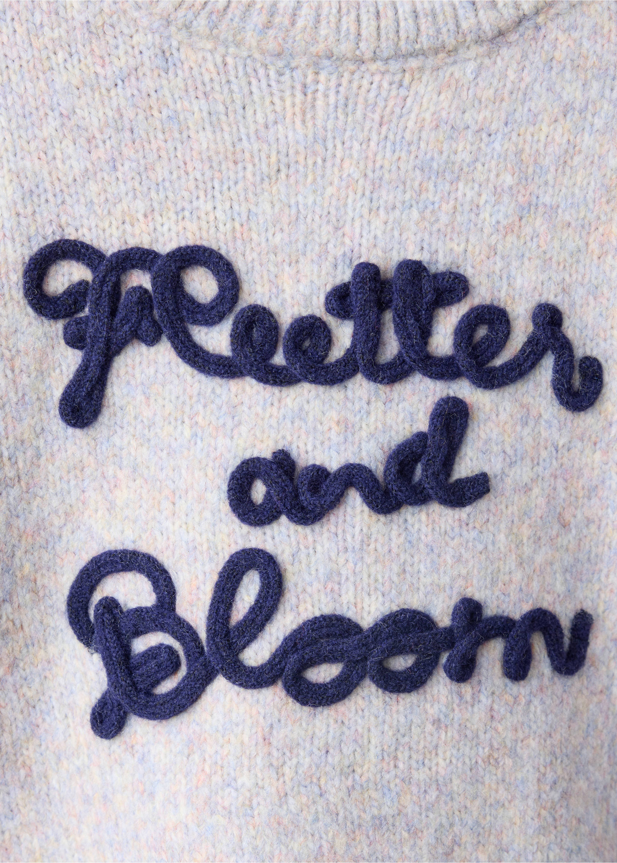 Close-up of a pastel multicoloured knit sweater with raised navy embroidered lettering., Lilac. Ref: 37008292-00.