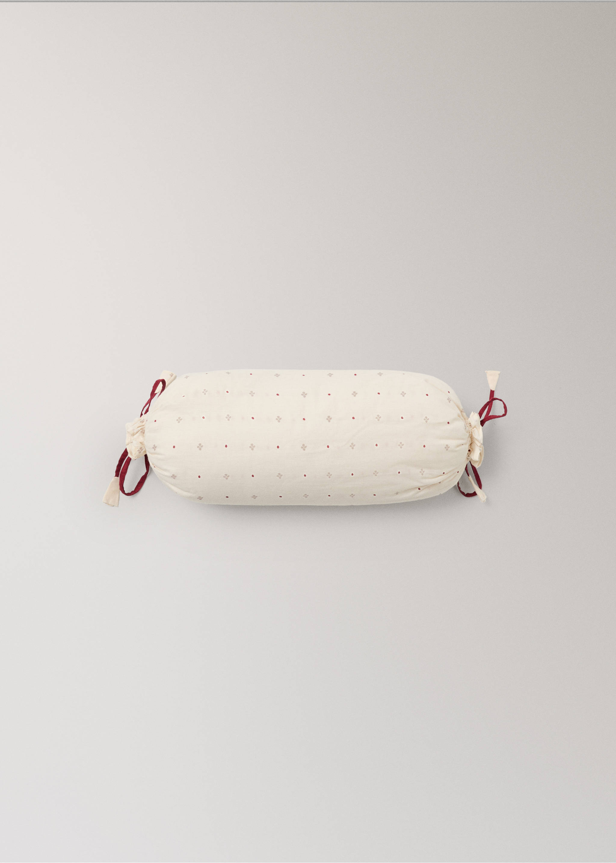Off-white cylindrical cushion with a geometric print and red drawstrings., Red. Ref: 37008638-00.