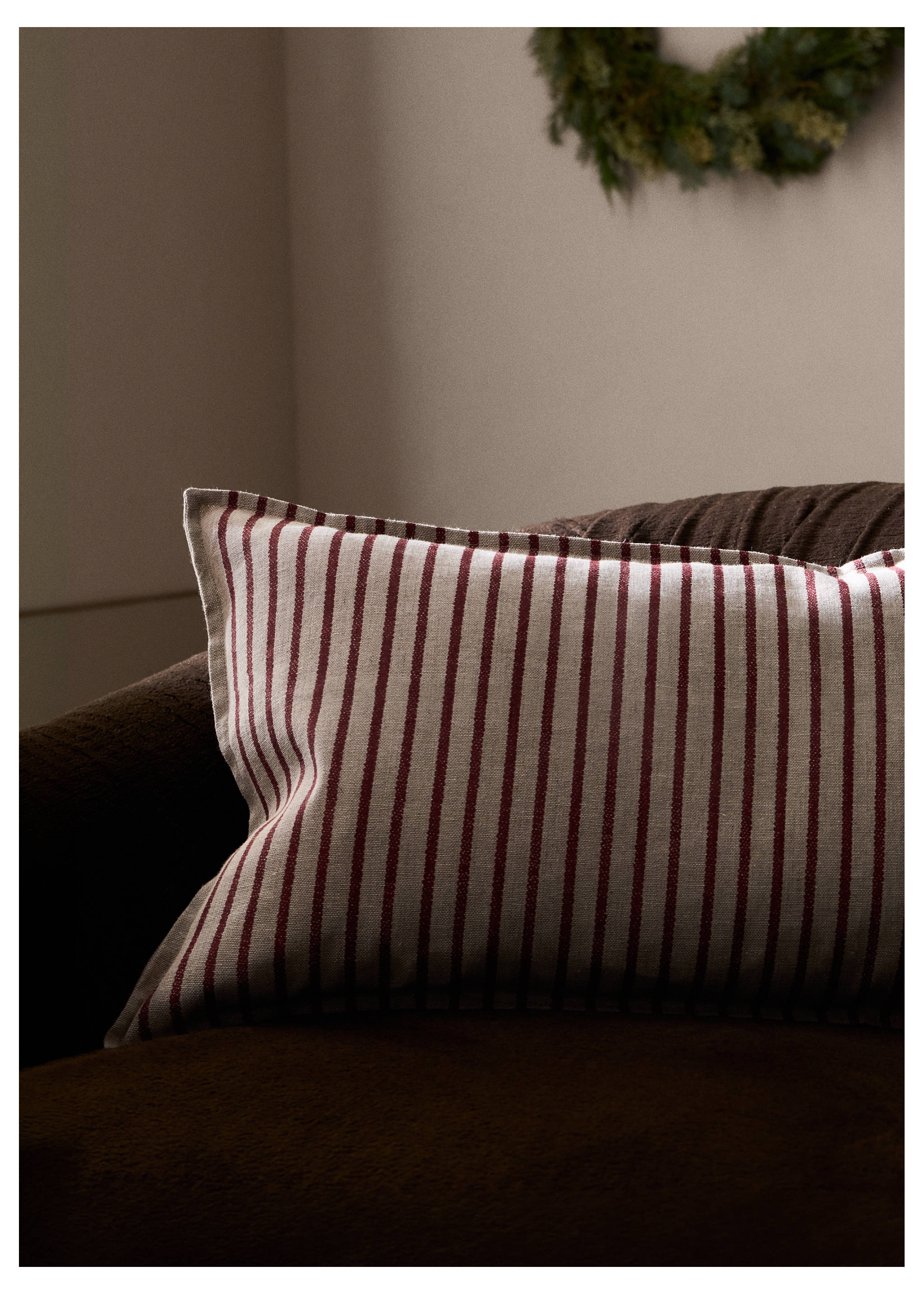 Rectangular cushion cover in beige with vertical burgundy stripes on an armchair., Red. Ref: 37008639-00.