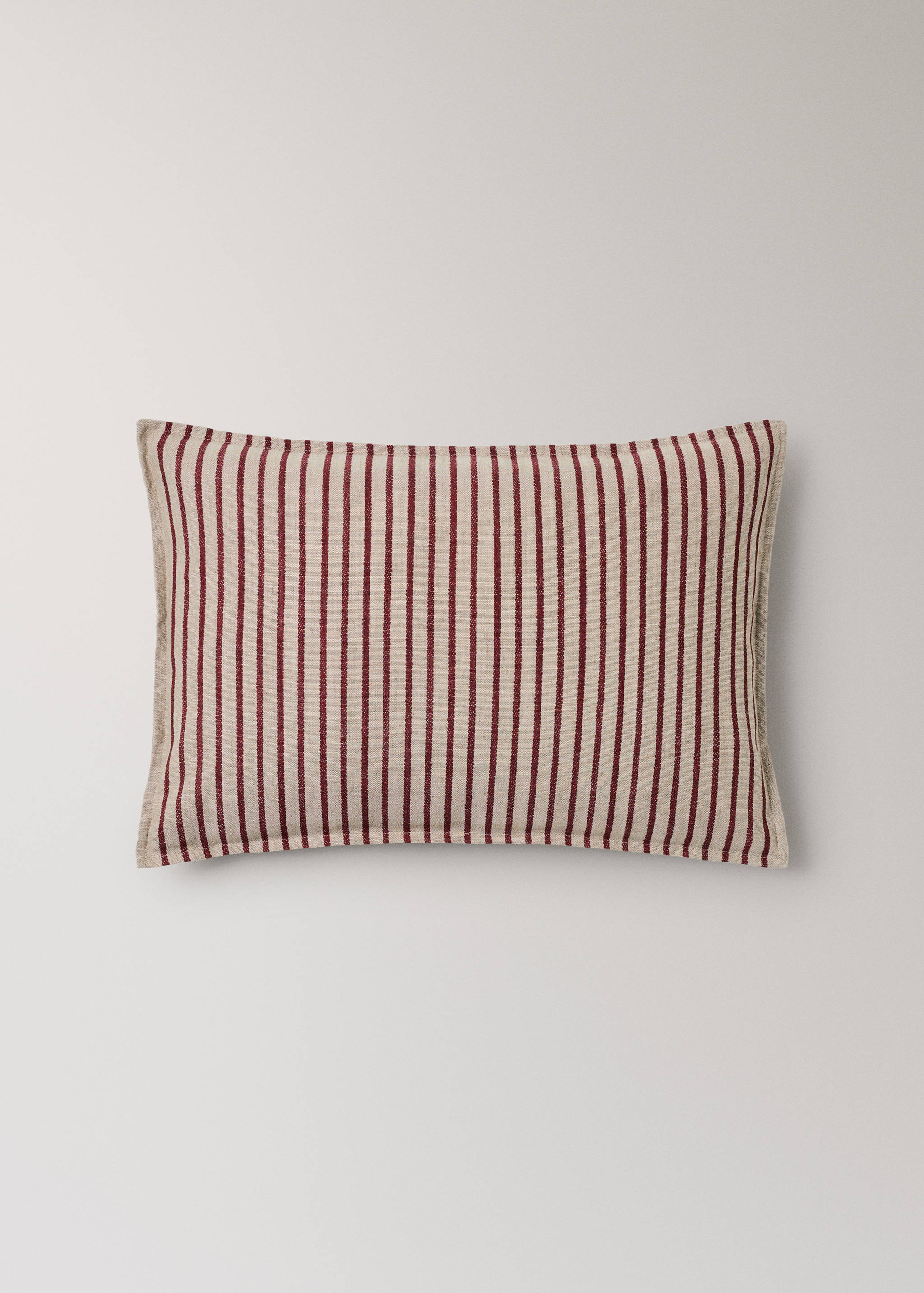 Striped cushion cover in beige and burgundy.