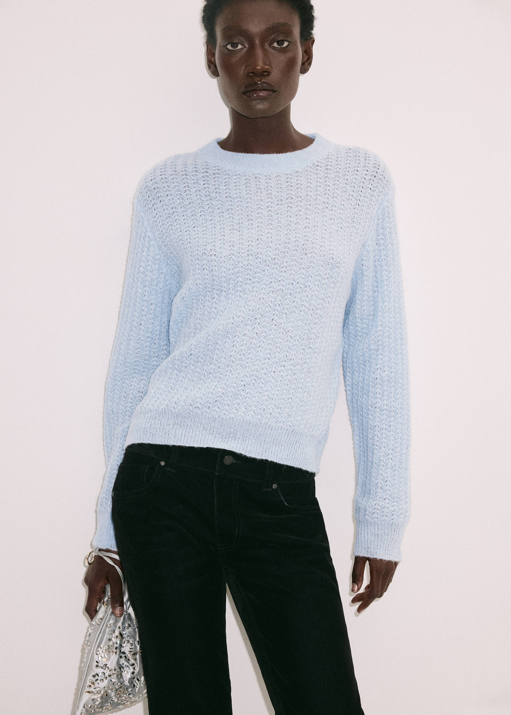Light blue crew neck jersey in textured open-work knit.