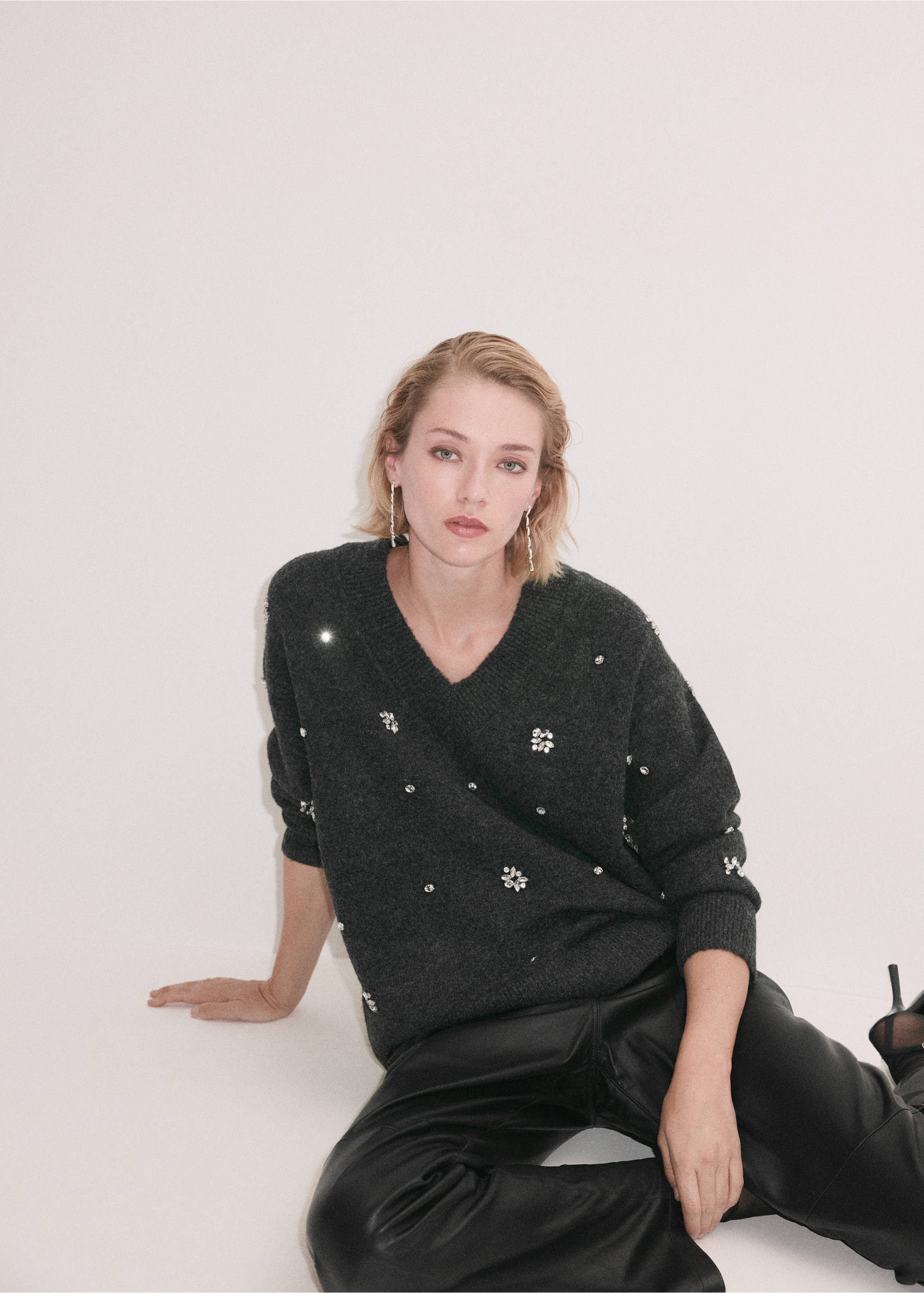 Dark grey V-neck jersey with rhinestone embellishments, worn with black trousers., Dark Heather Grey. Ref: 37009130-00.