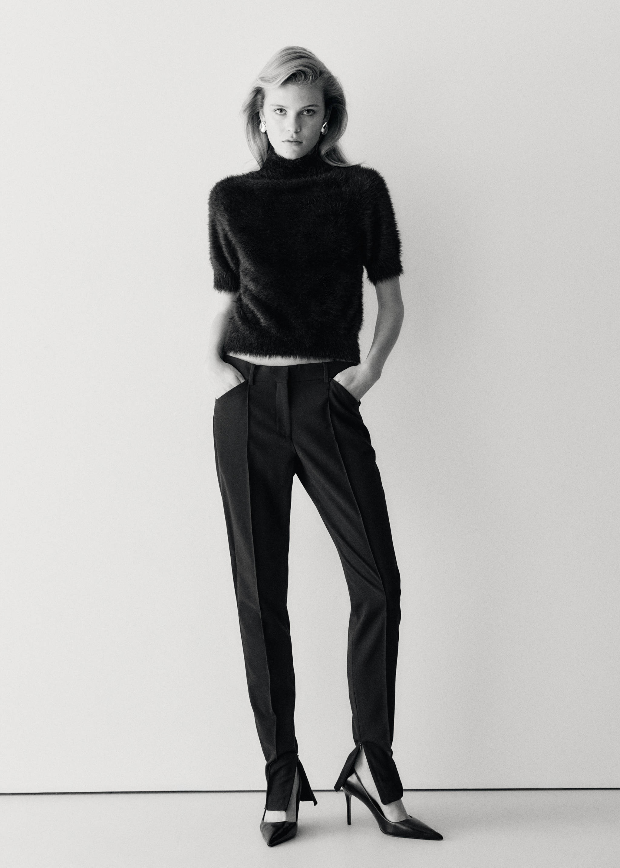 Black short-sleeved high-neck faux-fur jersey worn with trousers