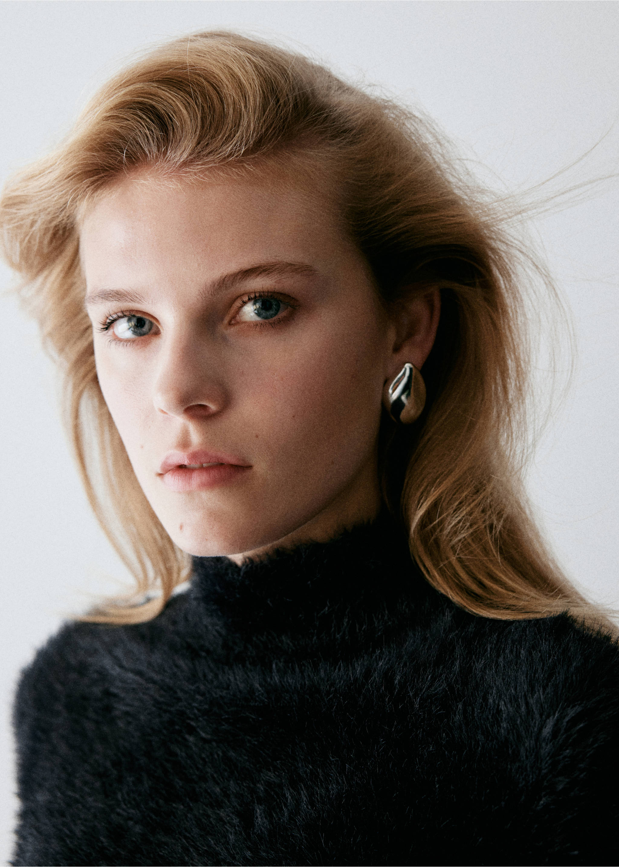 Close-up of a black textured knit jumper with a high neckline., Black. Ref: 37009131-00.