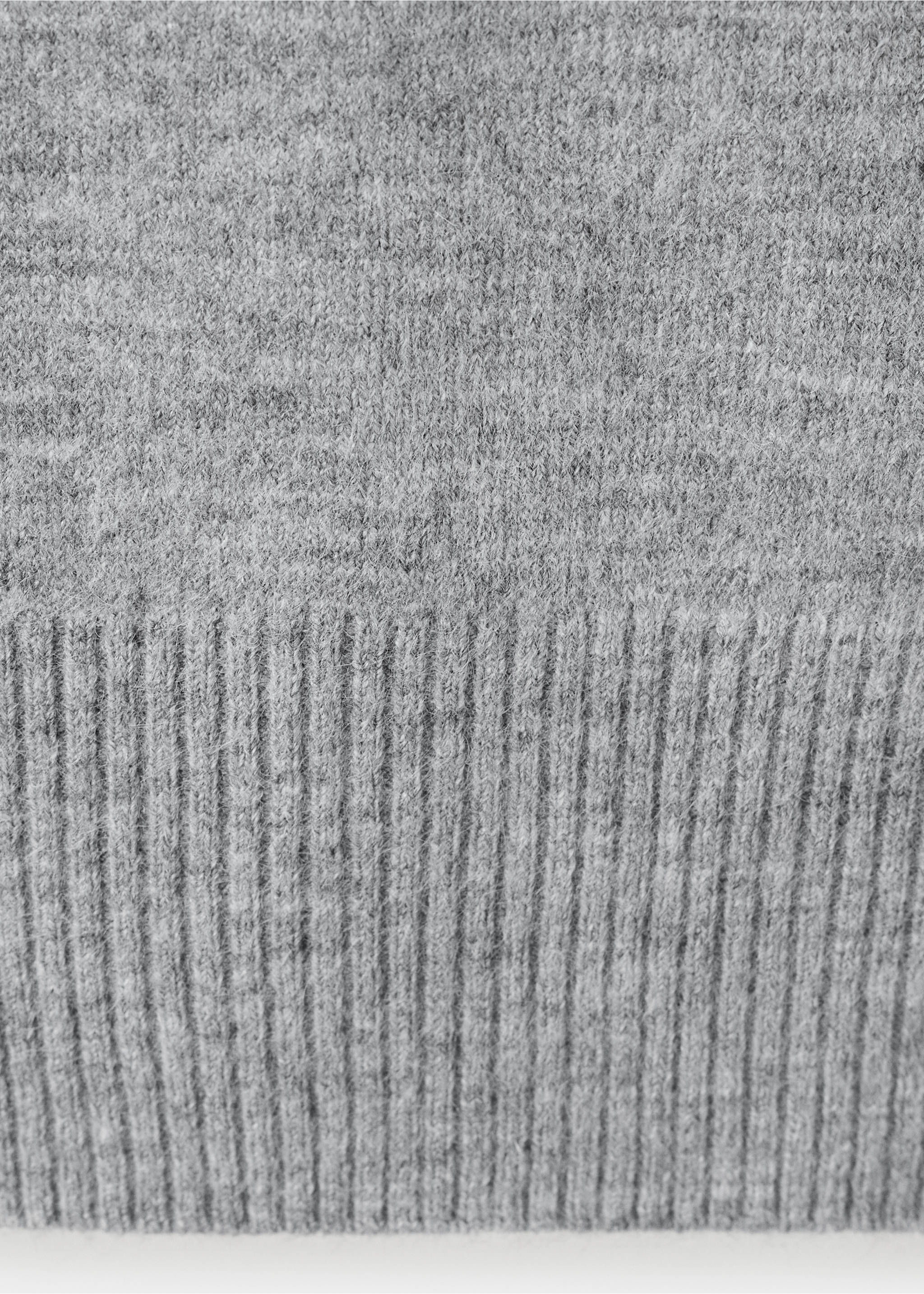 Close-up of a grey knit jersey fabric texture showing the ribbed hem., Light Heather Grey. Ref: 37009133-00.
