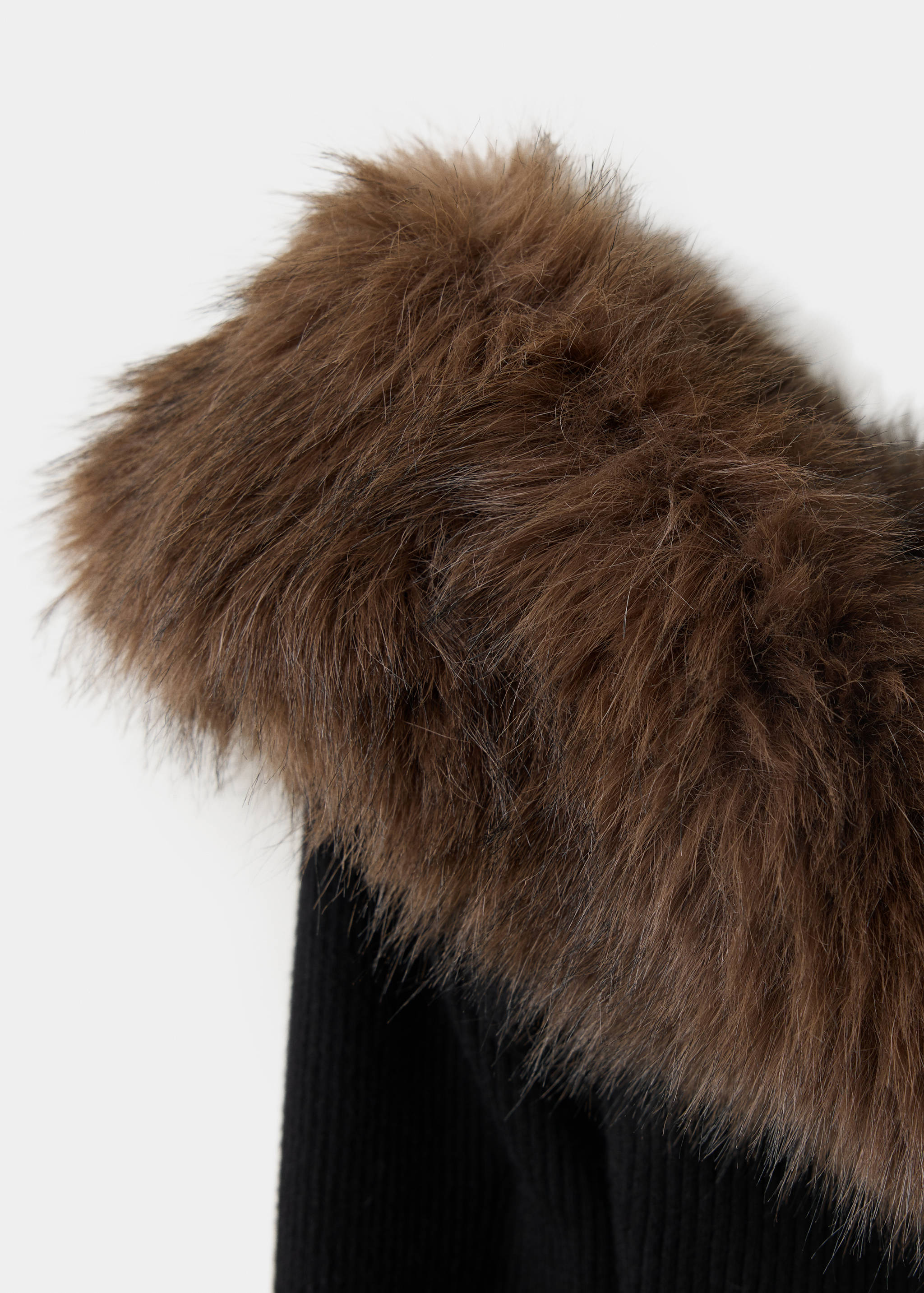 Close-up of a black jersey with a brown faux-fur collar.