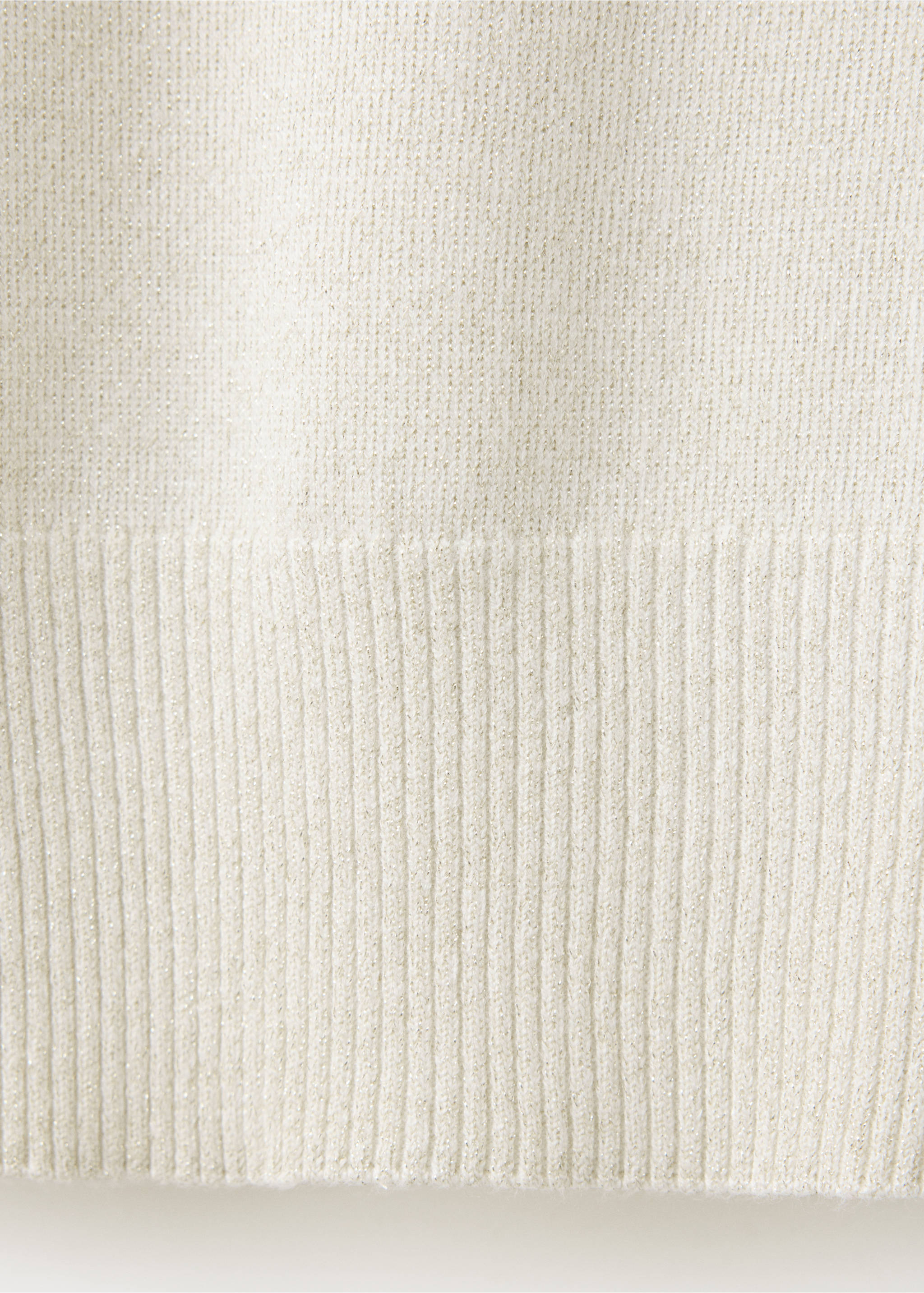 Close-up of an off-white jumper fabric showing a fine knit with metallic threads and a ribbed hem., Gold. Ref: 37009141-00.