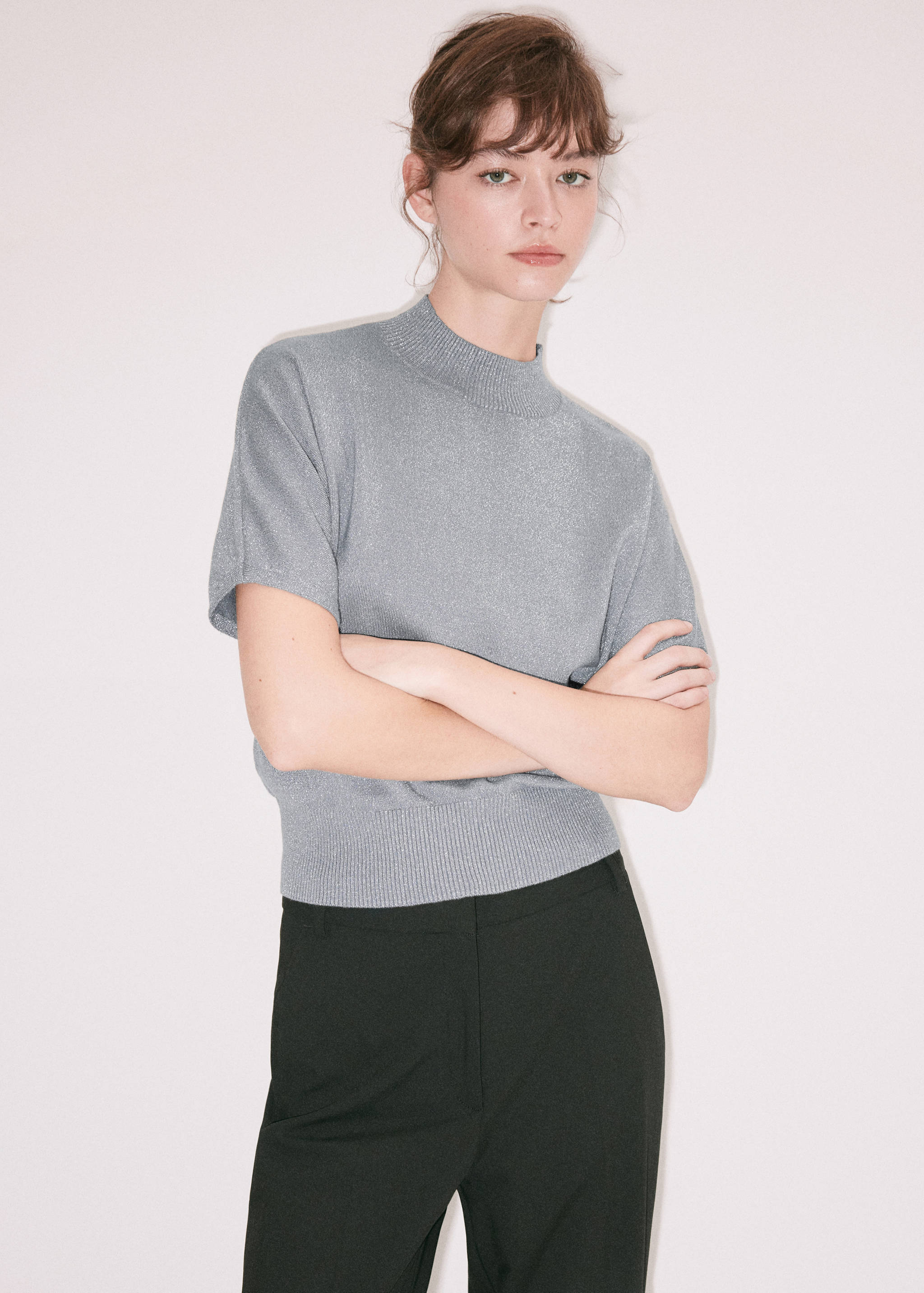 Grey short-sleeved metallic jersey with a ribbed mock neck and hem.