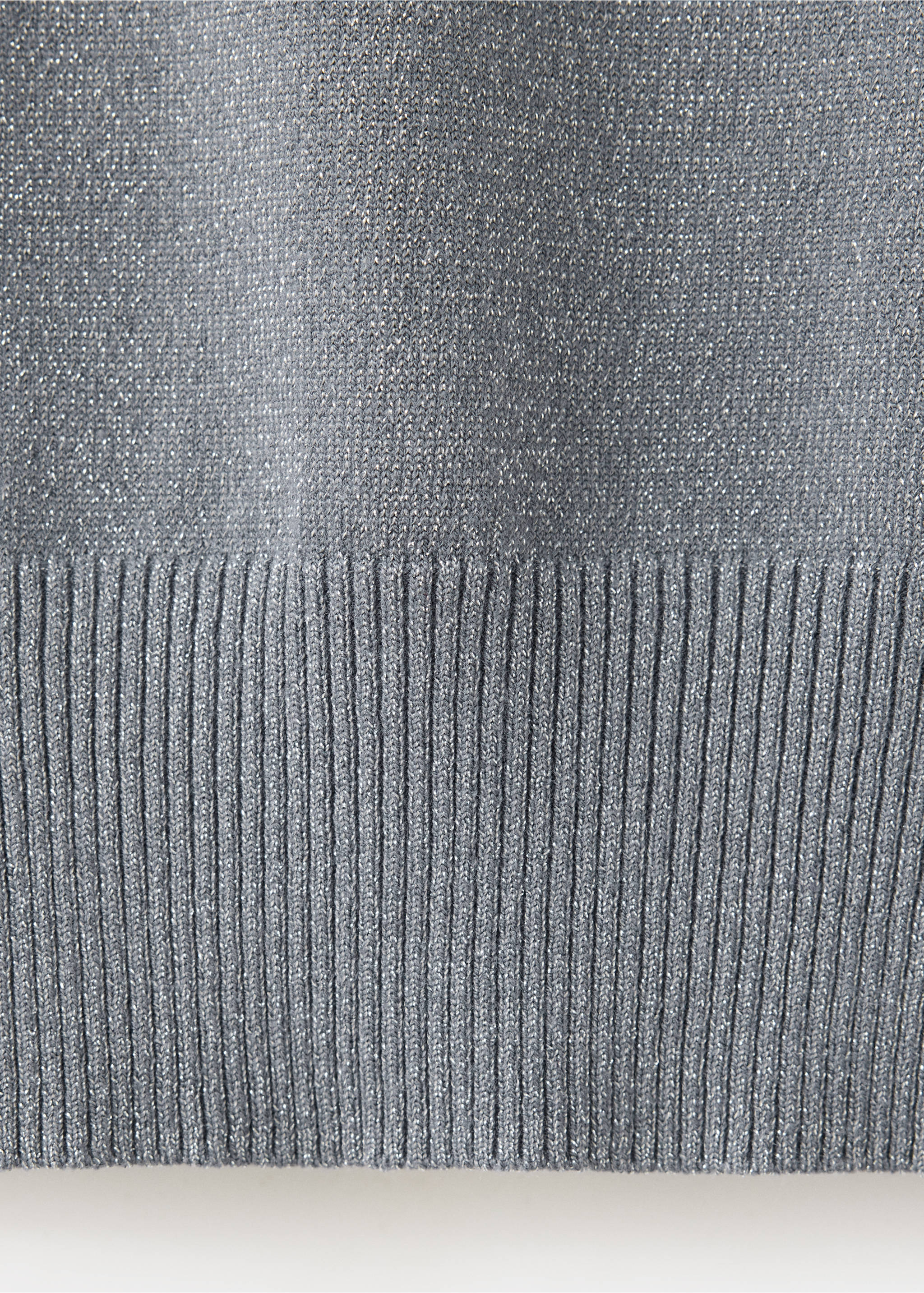 Close-up of a grey metallic-thread knitted jumper with a ribbed hem., Silver. Ref: 37009141-00.
