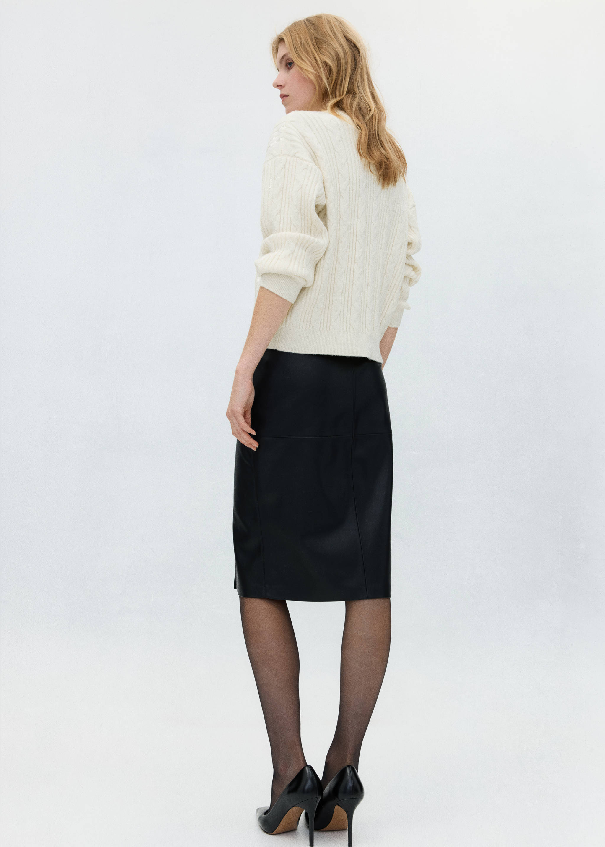 Cream cable-knit sweater, back view