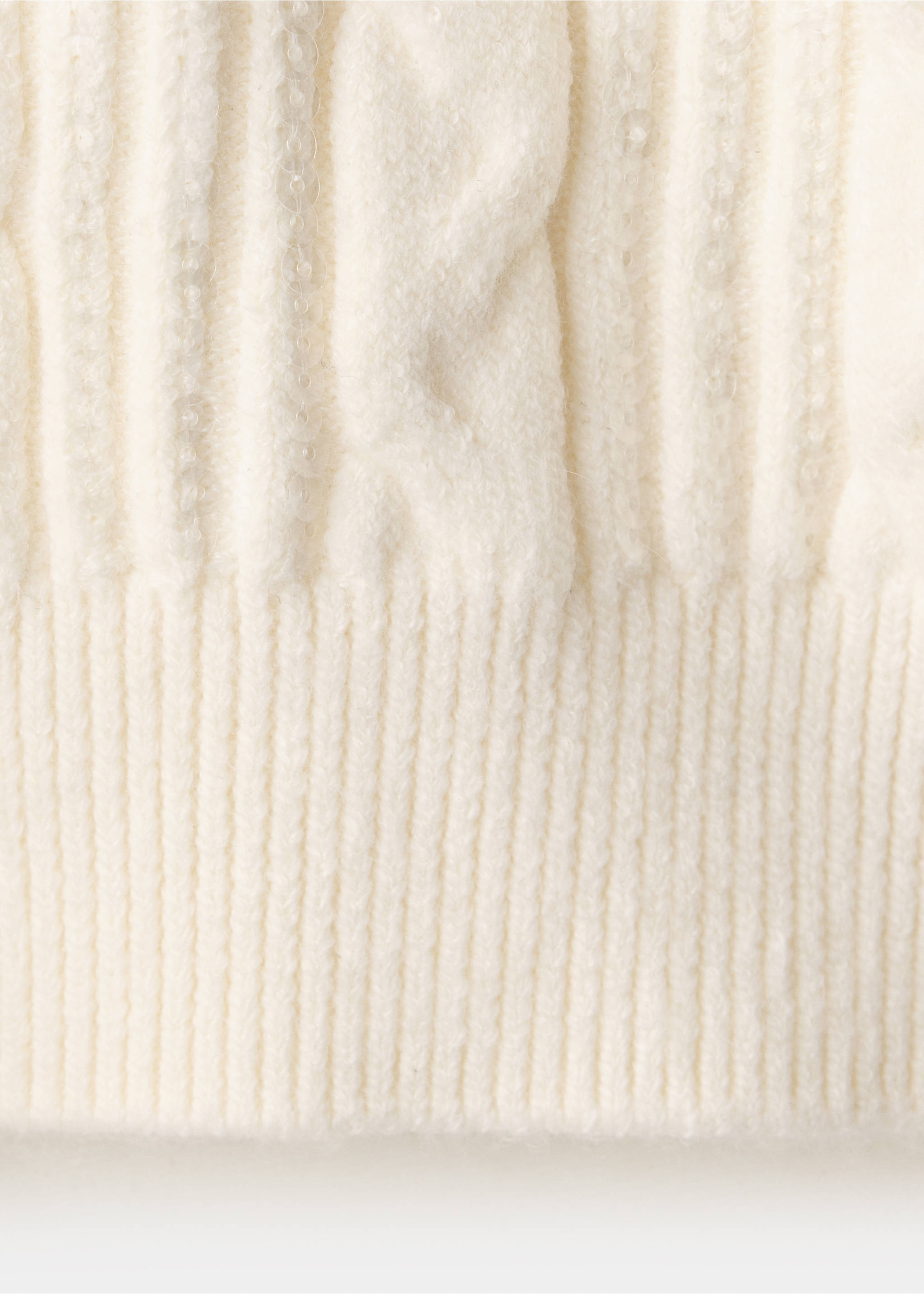 Close-up of a white cable-knit jumper texture with subtle sequins., Vanilla. Ref: 37009144-00.