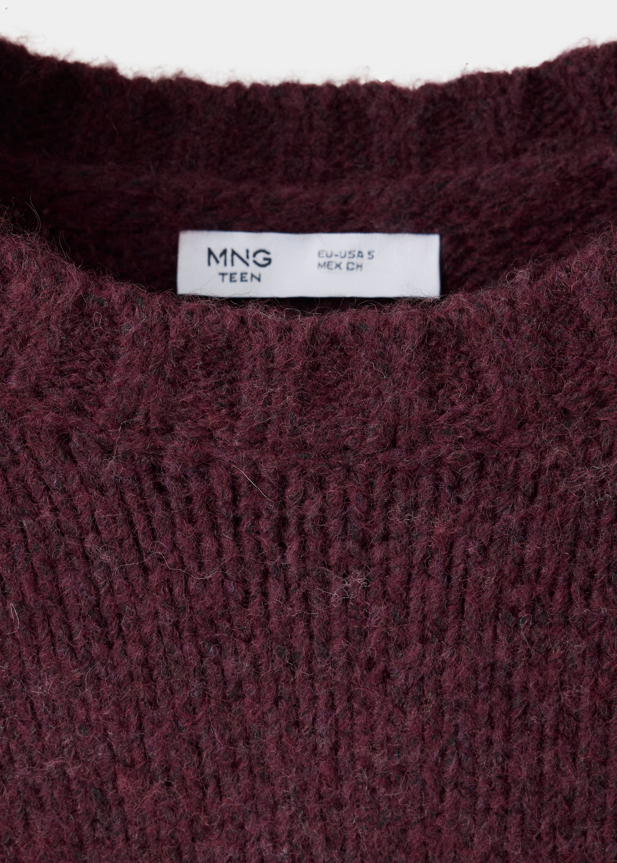 Burgundy knit jersey detail showing the ribbed crew neckline and collar label.