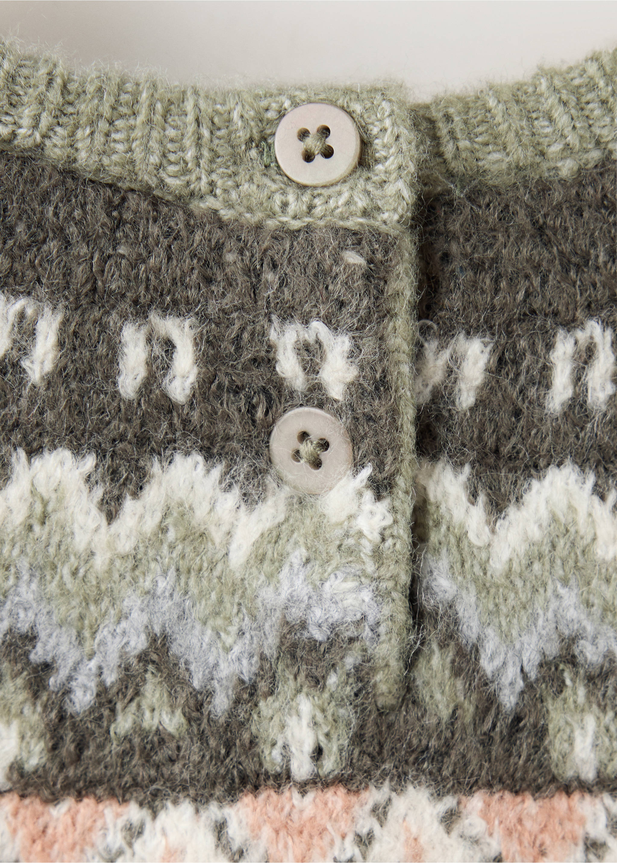 Close-up of the back button placket and patterned knit on a kids' multi-coloured sweater., Green. Ref: 37009154-00.