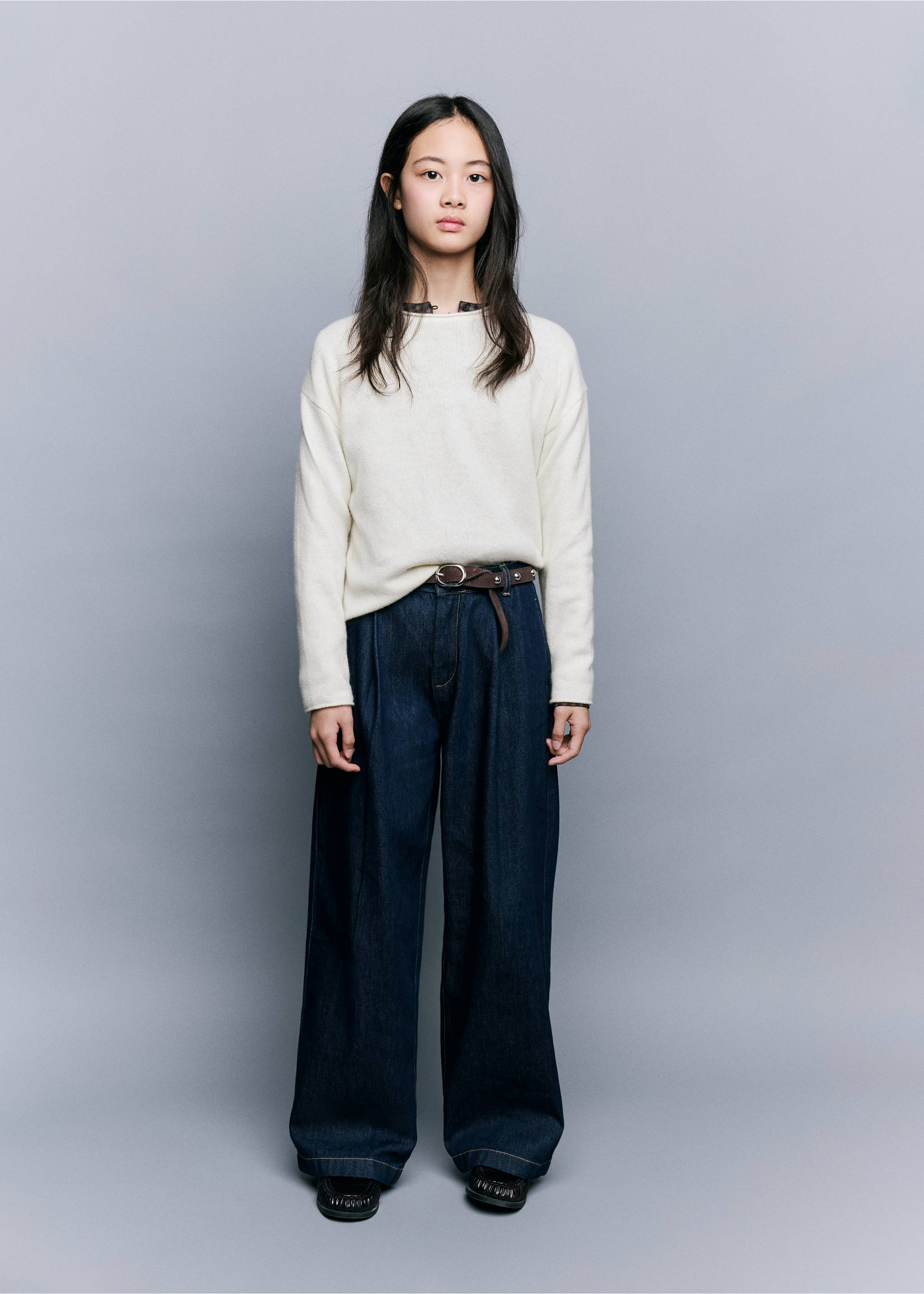 White long-sleeved fine-knit jersey paired with dark wide-leg trousers., Off White. Ref: 37009228-00.