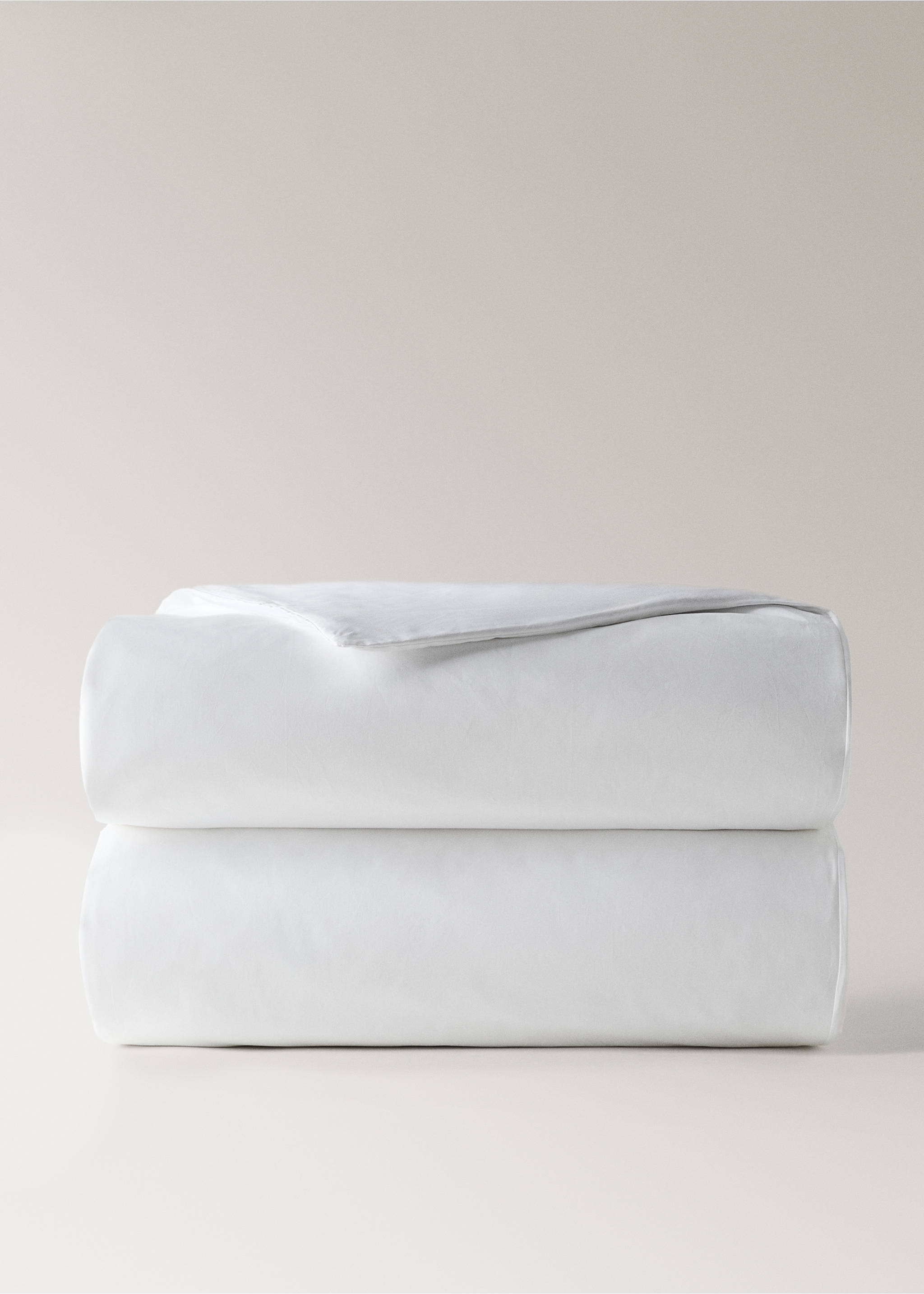 White duvet cover folded neatly in a front studio view., White. Ref: 37013040-00.